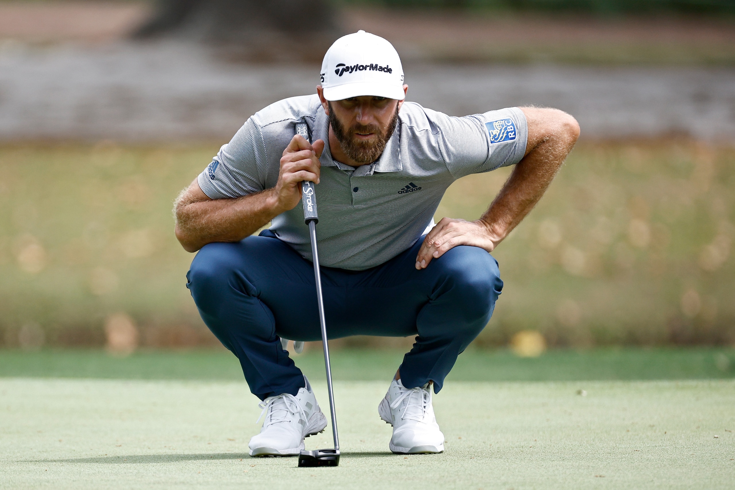 HILTON HEAD ISLAND, SOUTH CAROLINA - APRIL 14: Dustin Johnson lines up a putt on the seventh green during the first round of the RBC Heritage at Harbor Town Golf Links on April 14, 2022 in Hilton Head Island, South Carolina. (Photo by Jared C. Tilton/Getty Images)