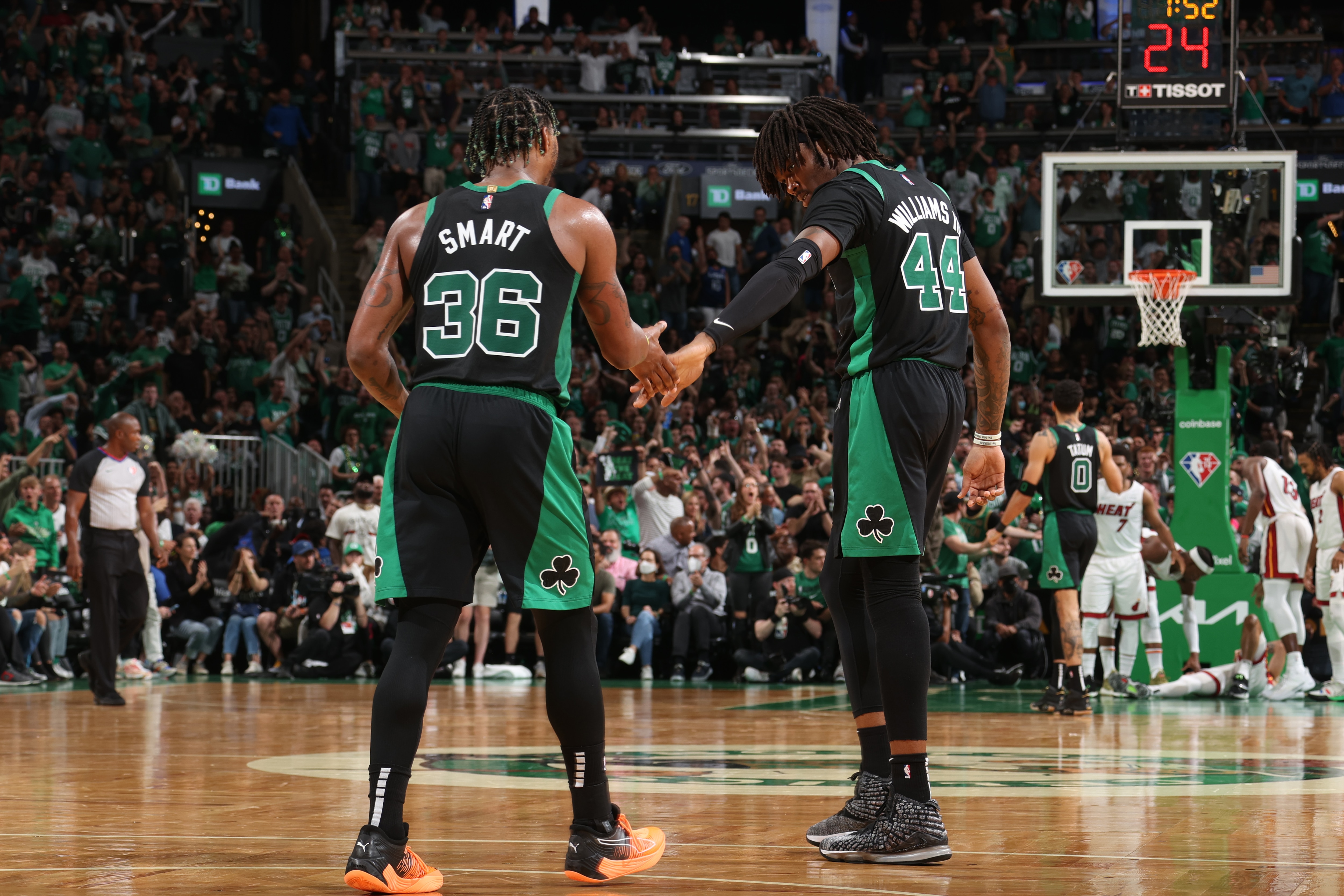 BOSTON, MA - MAY 27: Marcus Smart #36 hi-fives Robert Williams III #44 of the Boston Celtics during Game 6 of the 2022 NBA Playoffs Eastern Conference Finals on May 27, 2022 at the TD Garden in Boston, Massachusetts.  NOTE TO USER: User expressly acknowledges and agrees that, by downloading and or using this photograph, User is consenting to the terms and conditions of the Getty Images License Agreement. Mandatory Copyright Notice: Copyright 2022 NBAE  (Photo by Nathaniel S. Butler/NBAE via Getty Images)