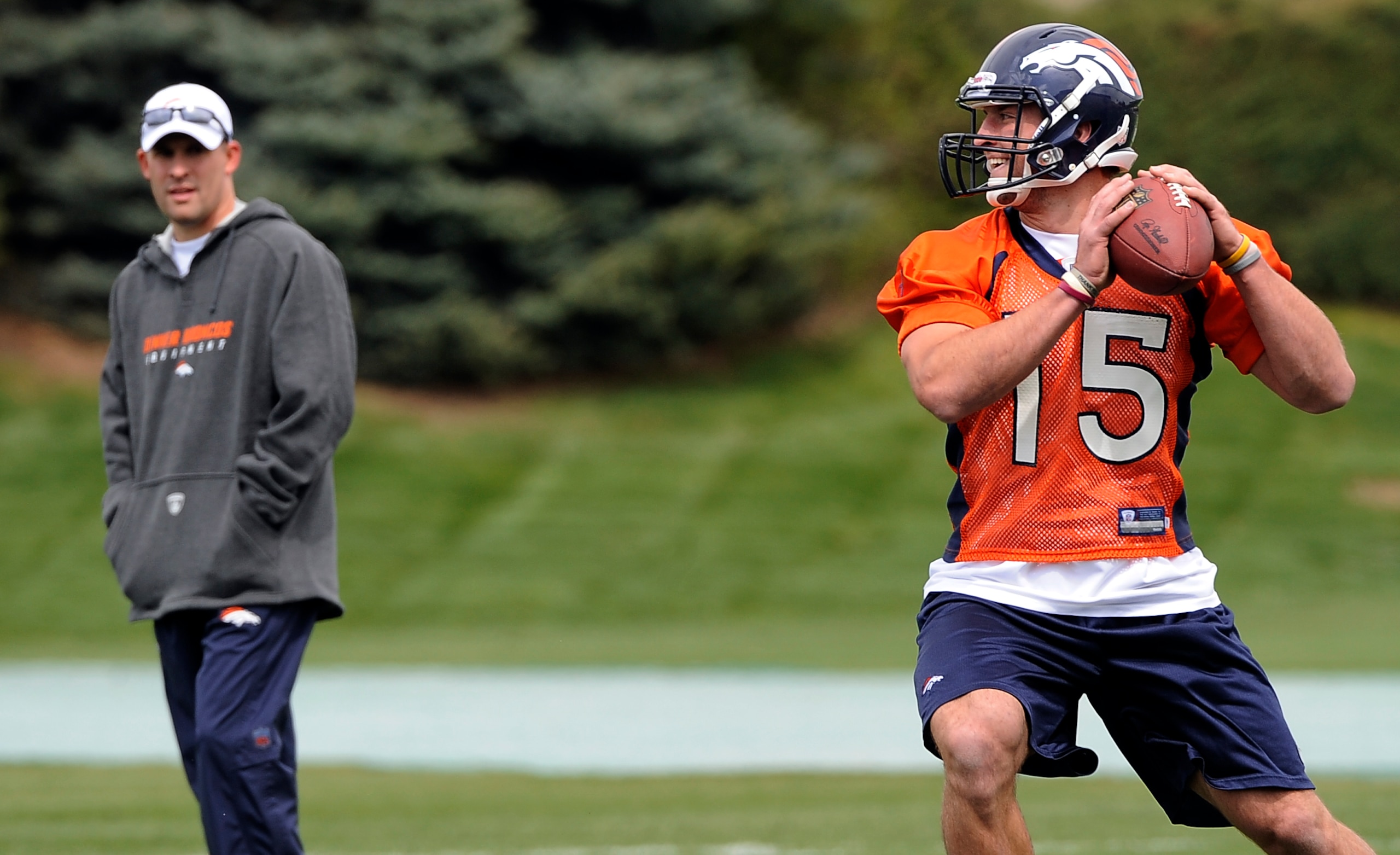 043010_BRONCOS_CFW - Josh McDaniels watches Tim Tebow taking part in the Denver Broncos rookie mini camp at Dove Valley in Englewood, CO. (Craig F. Walker / The Denver Post) (Photo By Craig F. Walker/The Denver Post via Getty Images) 043010_BRONCOS_CFW - Josh McDaniels watches Tim Tebow taking part in the Denver Broncos rookie mini camp at Dove Valley in Englewood, CO. (Craig F. Walker / The Denver Post) (Photo By Craig F. Walker/The Denver Post via Getty Images)