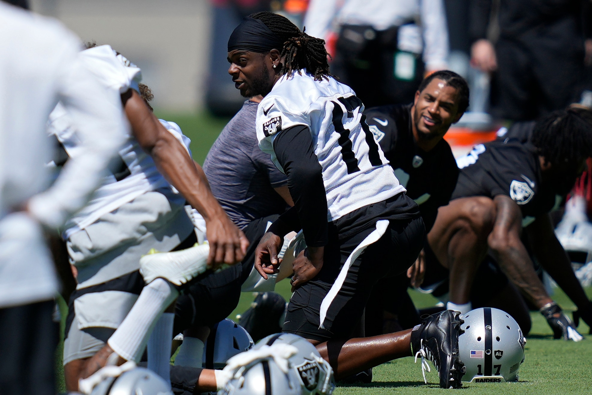 Raiders wide receiver Davante Adams warms up during practice at the NFL football team's practice facility Thursday, May 26, 2022, in Henderson, Nev. (AP Photo/John Locher)