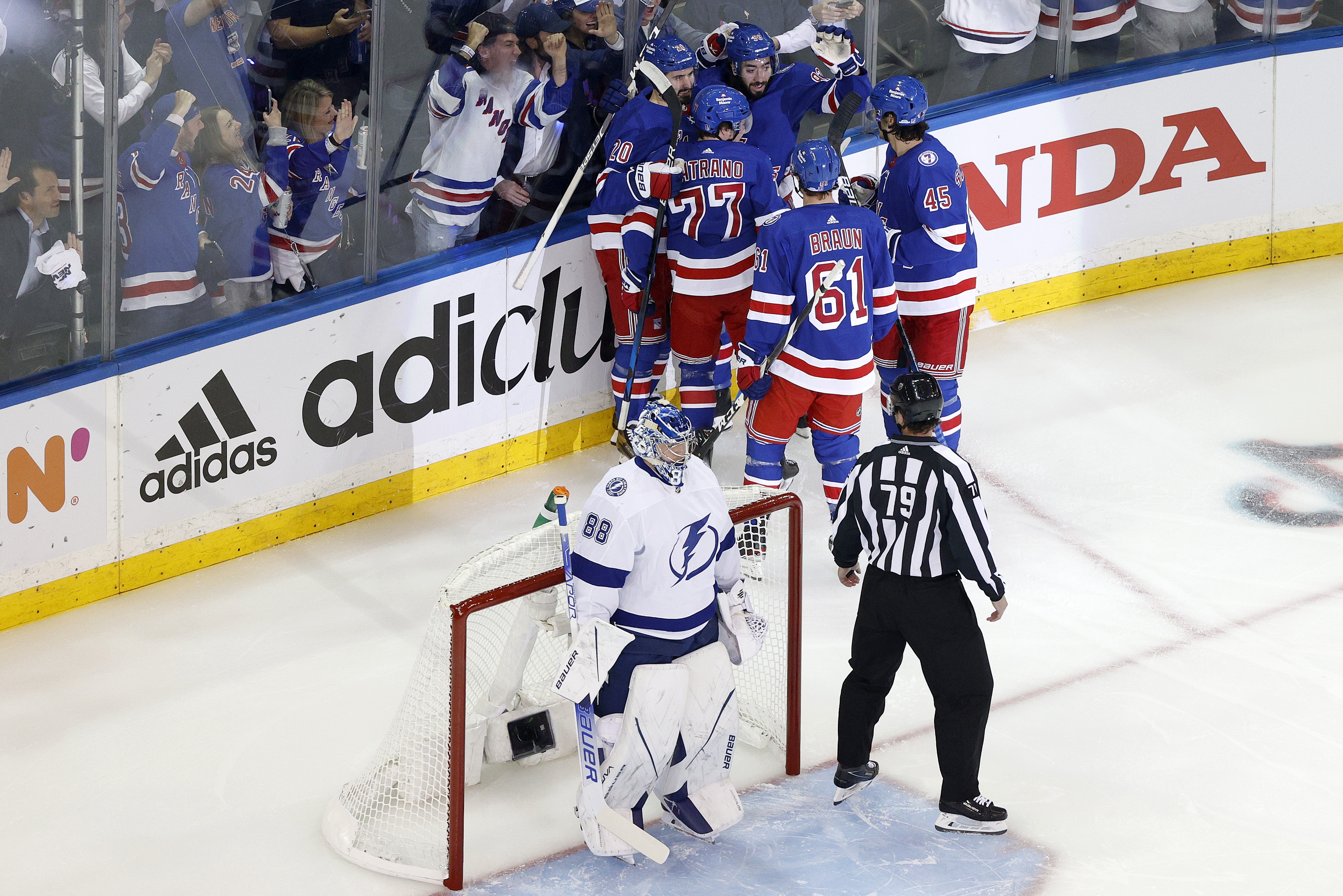 NEW YORK, NEW YORK - JUNE 01: Chris Kreider #20 of the New York Rangers celebrates with his teammates after scoring a goal on Andrei Vasilevskiy #88 of the Tampa Bay Lightning during the first period in Game One of the Eastern Conference Final of the 2022 Stanley Cup Playoffs at Madison Square Garden on June 01, 2022 in New York City. (Photo by Sarah Stier/Getty Images)