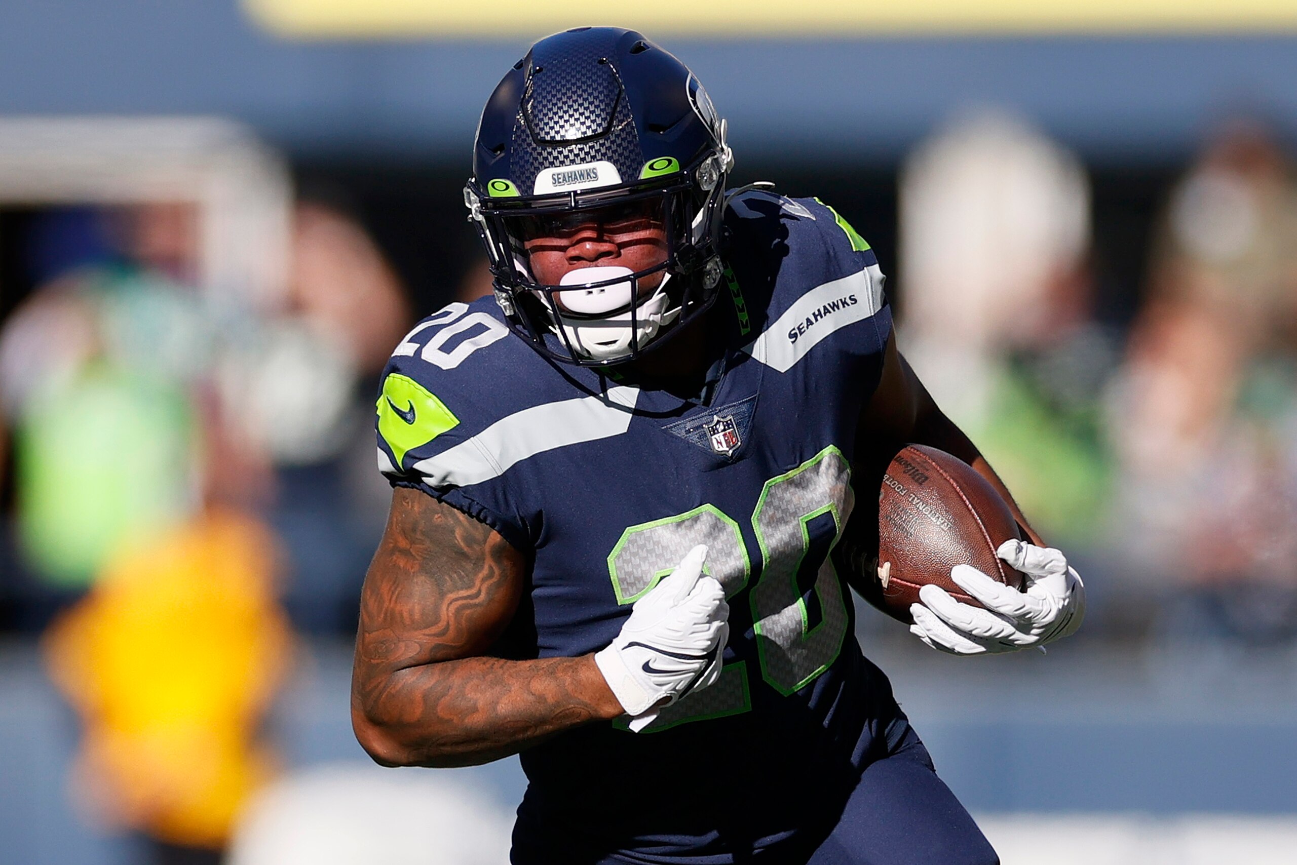 SEATTLE, WASHINGTON - OCTOBER 31: Rashaad Penny #20 of the Seattle Seahawks carries the ball against the Jacksonville Jaguars during the first quarter at Lumen Field on October 31, 2021 in Seattle, Washington. (Photo by Steph Chambers/Getty Images)