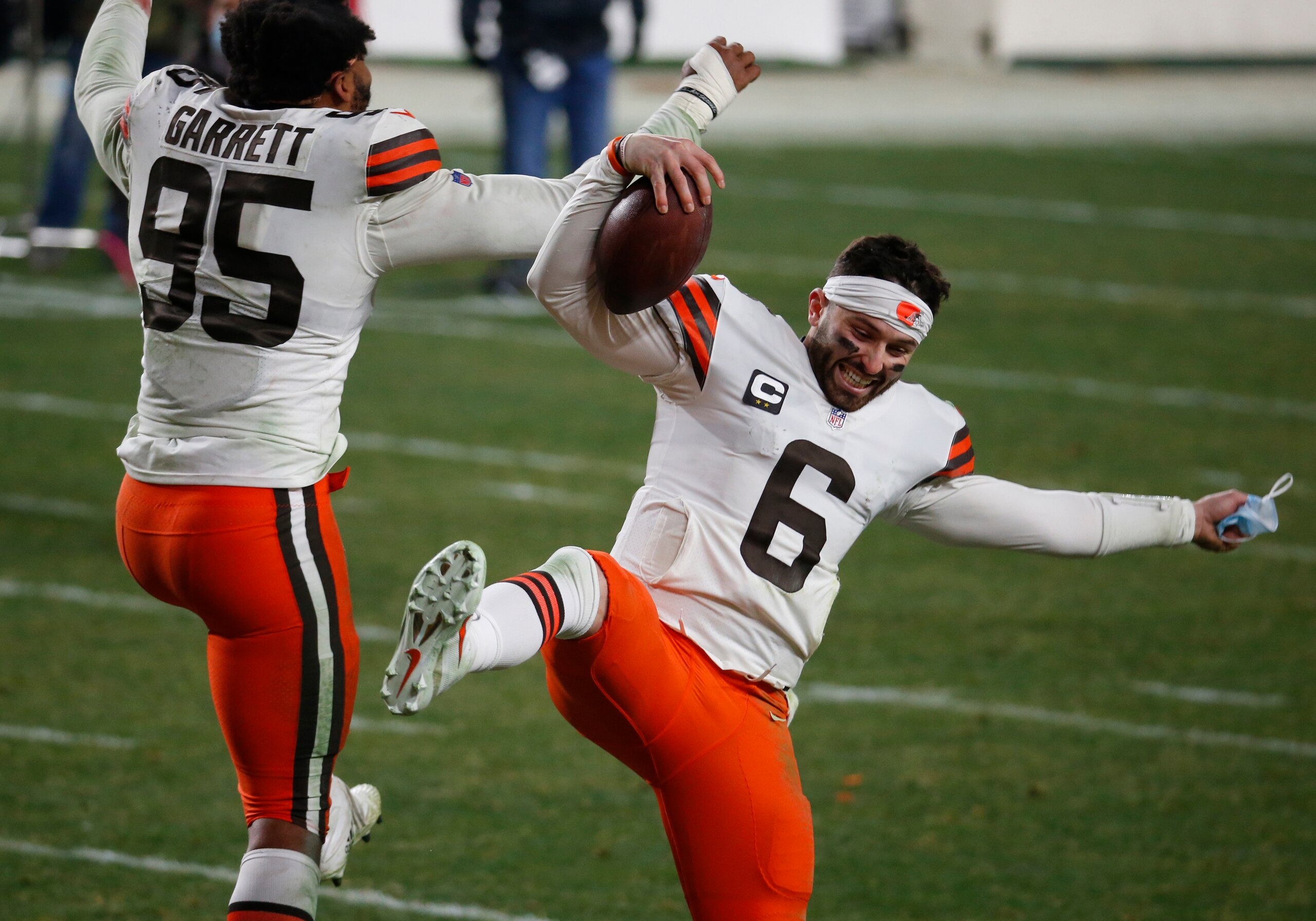 PITTSBURGH, PA - JANUARY 11:  Baker Mayfield #6 of the Cleveland Browns and Myles Garrett #95 of the Cleveland Browns celebrate against the Pittsburgh Steelers on January 11, 2021 at Heinz Field in Pittsburgh, Pennsylvania.  (Photo by Justin K. Aller/Getty Images)