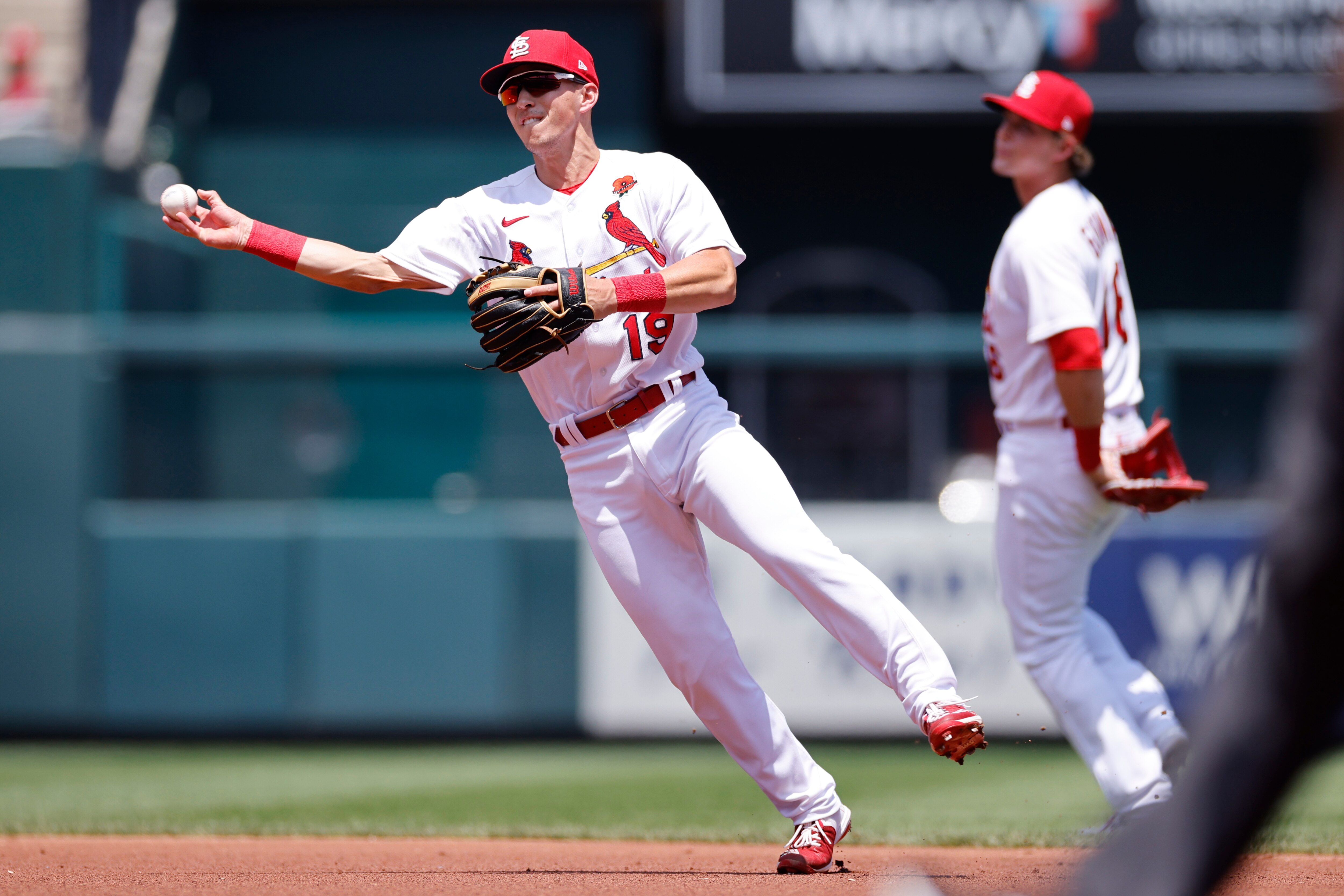 ST. LOUIS, MO - MAY 30: St. Louis Cardinals shortstop Tommy Edman (19) throws a runner out after fielding the ball during an MLB game against the San Diego Padres on May 30, 2022 at Busch Stadium in St. Louis, Missouri. (Photo by Joe Robbins/Icon Sportswire via Getty Images)