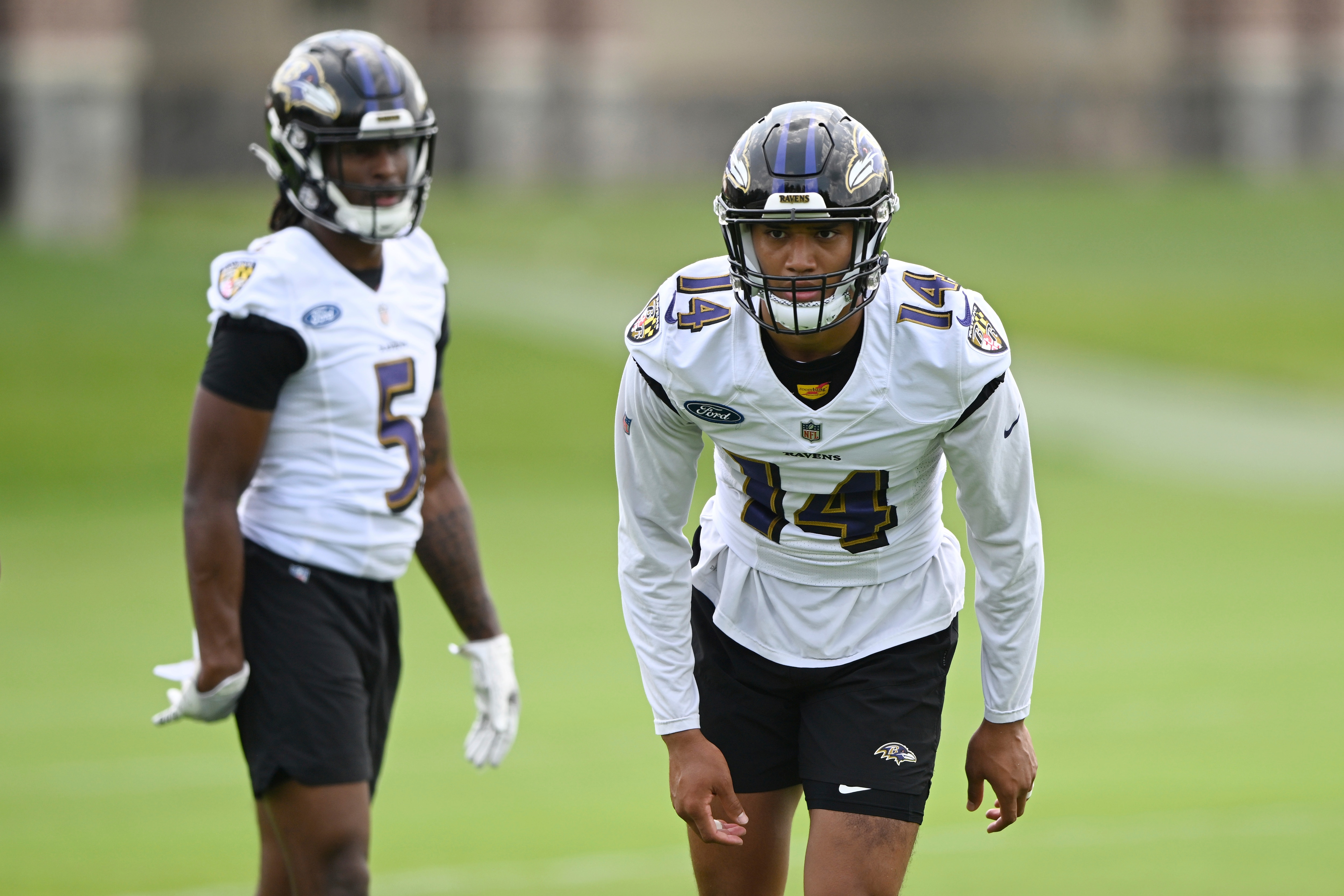 Baltimore Ravens safety Kyle Hamilton, right, waits for a pass during a NFL football practice Wednesday, June 1, 2022, in Owings Mills, Md. (AP Photo/Gail Burton)