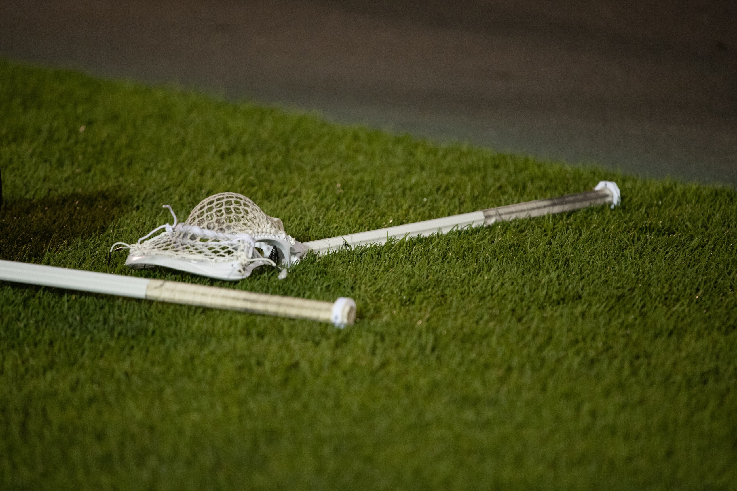EAST HARTFORD, CT - MAY 28: A lacrosse stick lies on the field following the completion of the NCAA Division I Mens Lacrosse Semifinals game between the Maryland Terrapins and Princeton Tigers on May 28, 2022, at Rentschler Field at Pratt & Whitney Stadium in East Hartford, Connecticut. The Terrapins defeated the Tigers 13-8. (Photo by Erica Denhoff/Icon Sportswire via Getty Images)