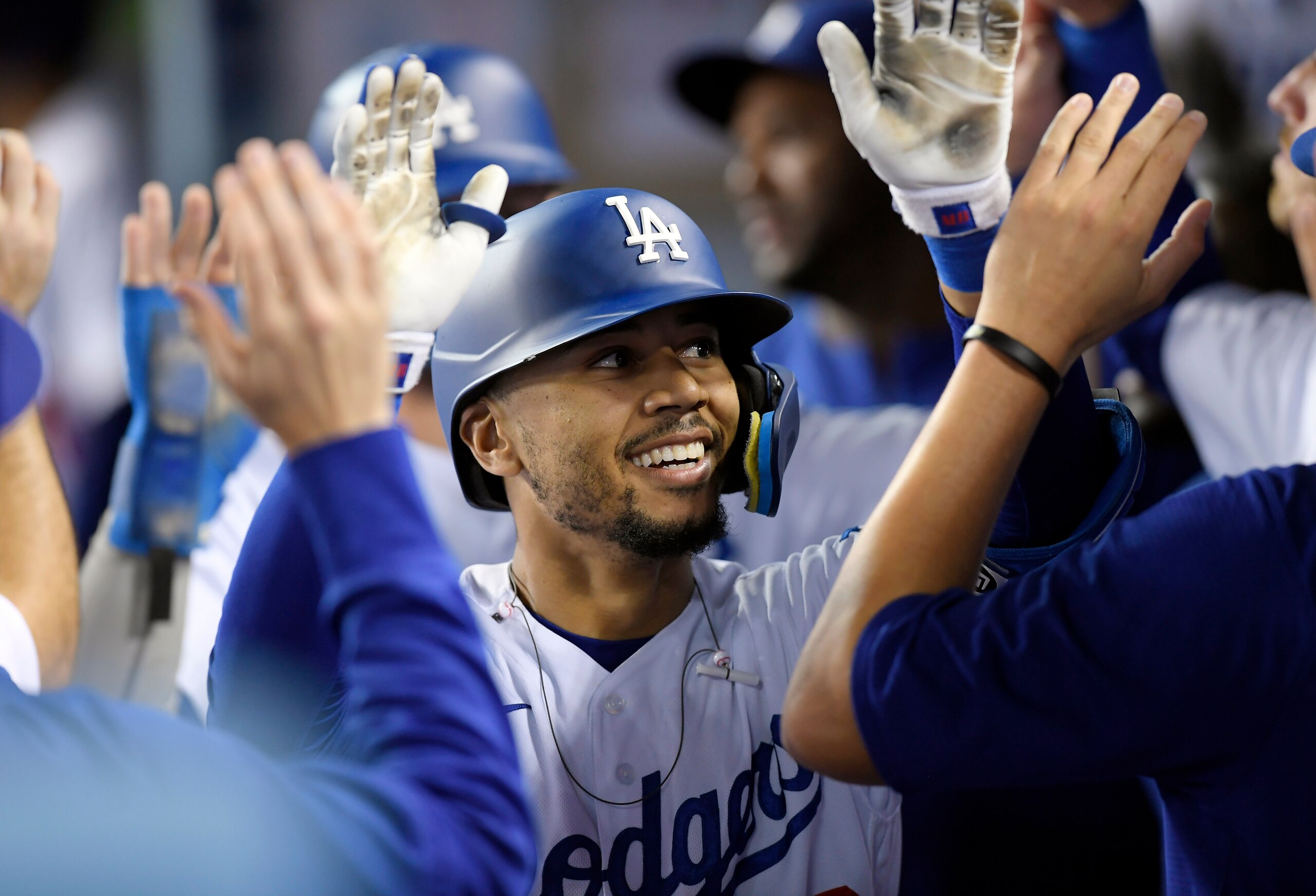 LOS ANGELES, CA - JUNE 01: Mookie Betts #50 of the Los Angeles Dodgers celebrates his two-run home run in the dugout against reliever Anthony Banda of the Pittsburgh Pirates in the ninth inning at Dodger Stadium on June 1, 2022 in Los Angeles, California. (Photo by Kevork Djansezian/Getty Images)