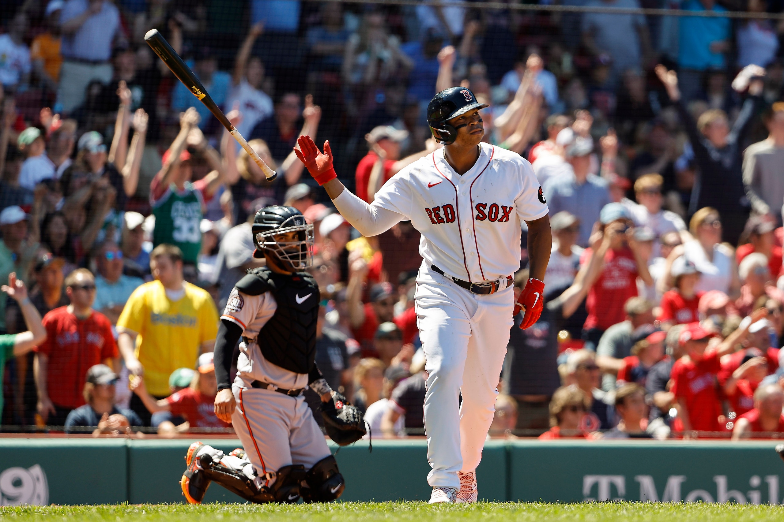 BOSTON, MA - MAY 29: Catcher Robinson Chirinos #23 of the Baltimore Orioles looks on as Rafael Devers #11 of the Boston Red Sox tosses his bat after his home run during the third inning at Fenway Park on May 29, 2022 in Boston, Massachusetts. (Photo By Winslow Townson/Getty Images)