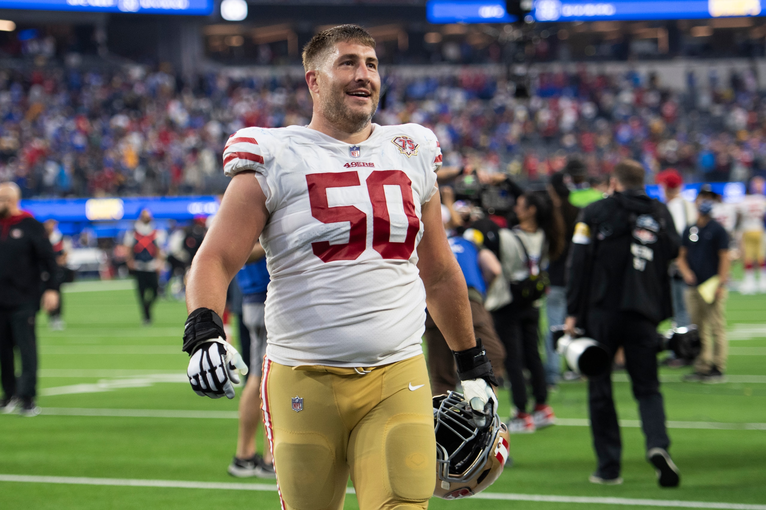 San Francisco 49ers center Alex Mack (50) walks back to the locker room after an NFL football game against the Los Angeles Rams Sunday, Jan. 9, 2022, in Inglewood, Calif. (AP Photo/Kyusung Gong)