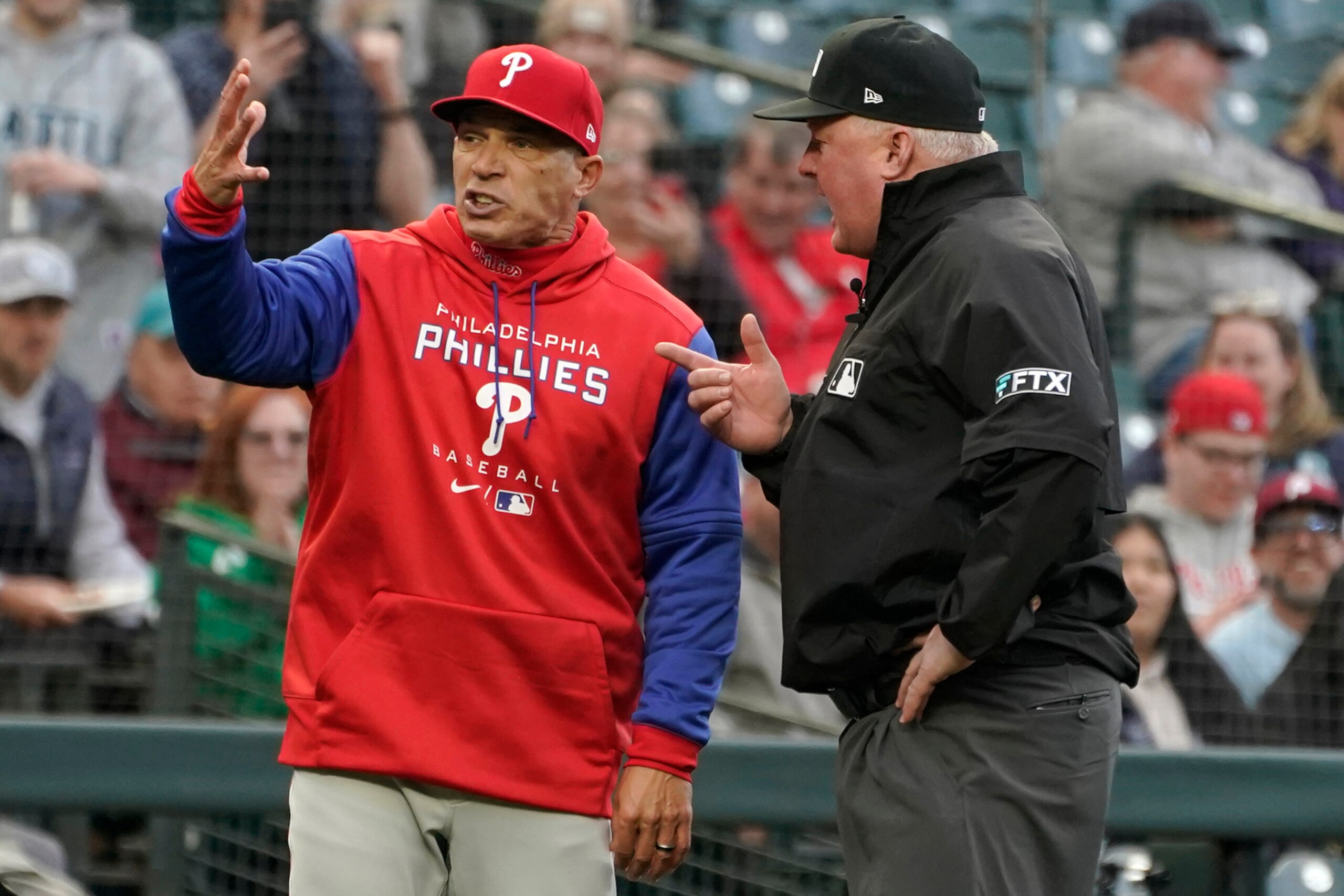 Philadelphia Phillies manager Joe Girardi, left, argues with third base umpire Bill Miller, right, after Girardi was ejected for disputing a call at first base during the second inning of a baseball game against the Philadelphia Phillies, Tuesday, May 10, 2022, in Seattle. (AP Photo/Ted S. Warren) Philadelphia Phillies manager Joe Girardi, left, argues with third base umpire Bill Miller, right, after Girardi was ejected for disputing a call at first base during the second inning of a baseball game against the Philadelphia Phillies, Tuesday, May 10, 2022, in Seattle. (AP Photo/Ted S. Warren)