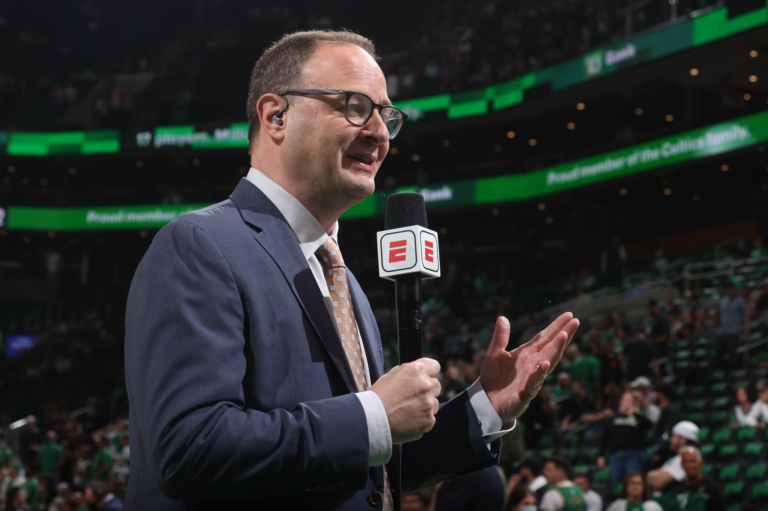 BOSTON, MA - MAY 23: ESPN Analyst, Adrian Wojnarowski reports on the game between the Miami Heat and the Boston Celtics during Game 4 of the 2022 NBA Playoffs Eastern Conference Finals on May 23, 2022 at the TD Garden in Boston, Massachusetts.  NOTE TO USER: User expressly acknowledges and agrees that, by downloading and or using this photograph, User is consenting to the terms and conditions of the Getty Images License Agreement. Mandatory Copyright Notice: Copyright 2022 NBAE  (Photo by Nathaniel S. Butler/NBAE via Getty Images)