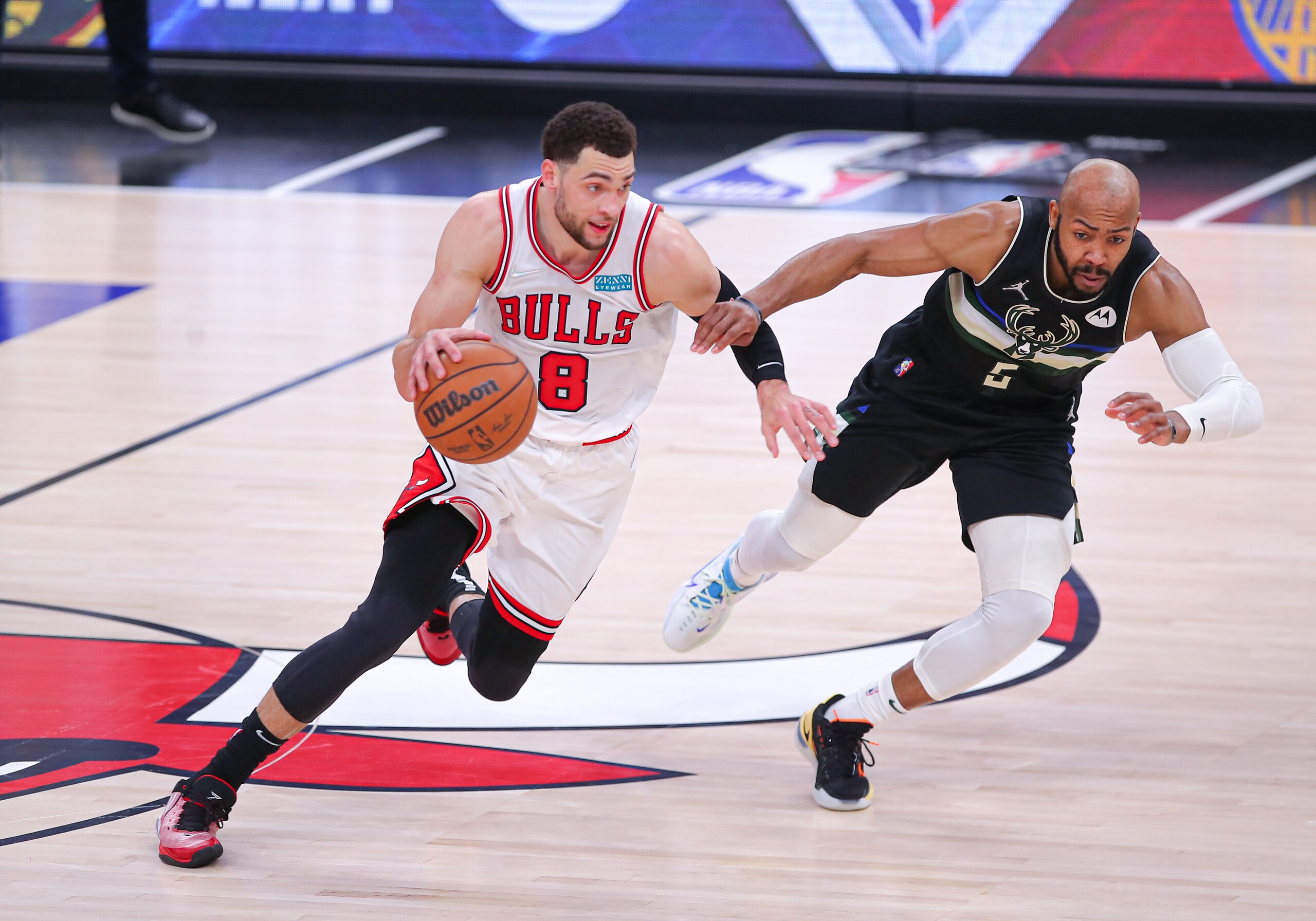 CHICAGO, IL - APRIL 24: Chicago Bulls guard Zach LaVine (8) and Milwaukee Bucks guard Jevon Carter (5) in action during Game Four of the Eastern Conference First Round Playoffs between the Milwaukee  Bucks and the Chicago Bulls on April 24, 2022 at the United Center in Chicago, IL. (Photo by Melissa Tamez/Icon Sportswire via Getty Images)