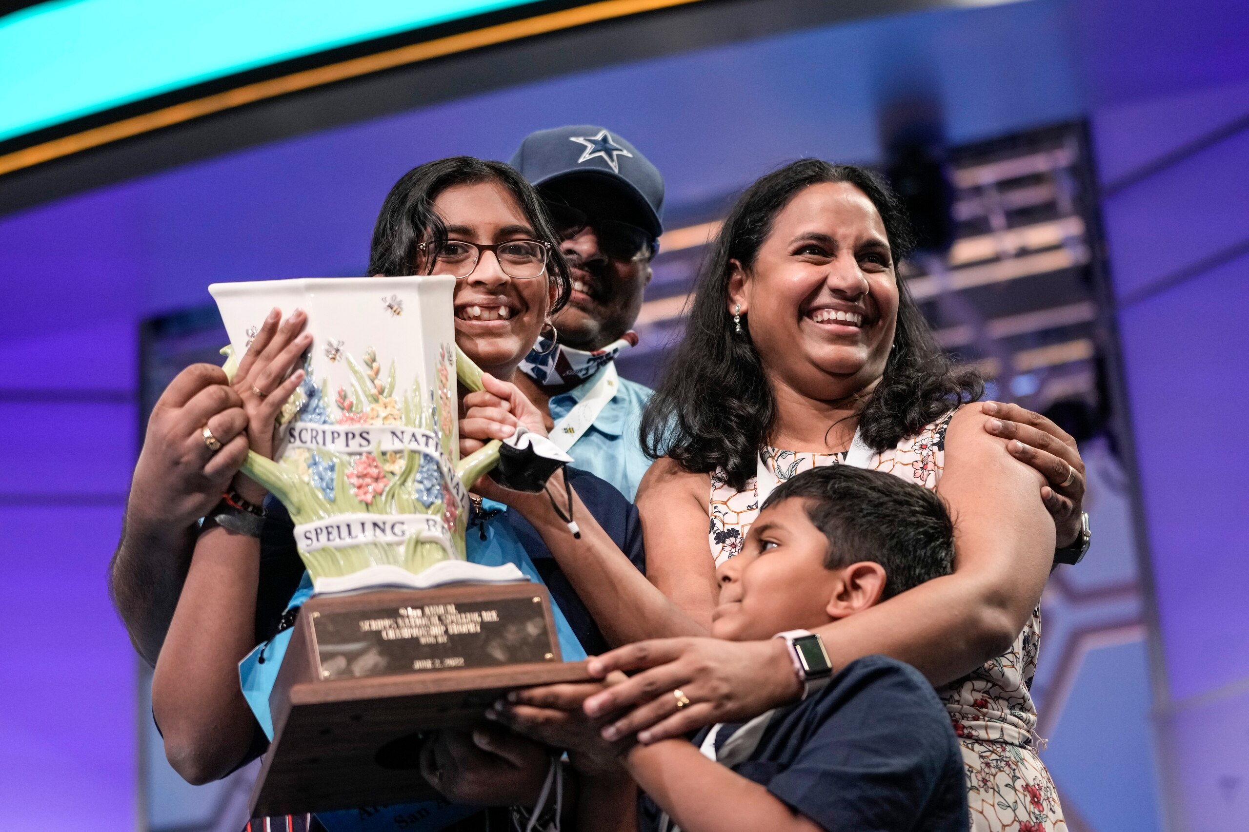 OXON HILL, MD - JUNE 2: 14-year-old Harini Logan from San Antonio, Texas is embraced by family after winning the Scripps National Spelling Bee at the Gaylord National Harbor Resort on June 2, 2022 in Oxon Hill, Maryland. 234 spellers are competing in the first fully in-person Bee since 2019. (Photo by Drew Angerer/Getty Images)