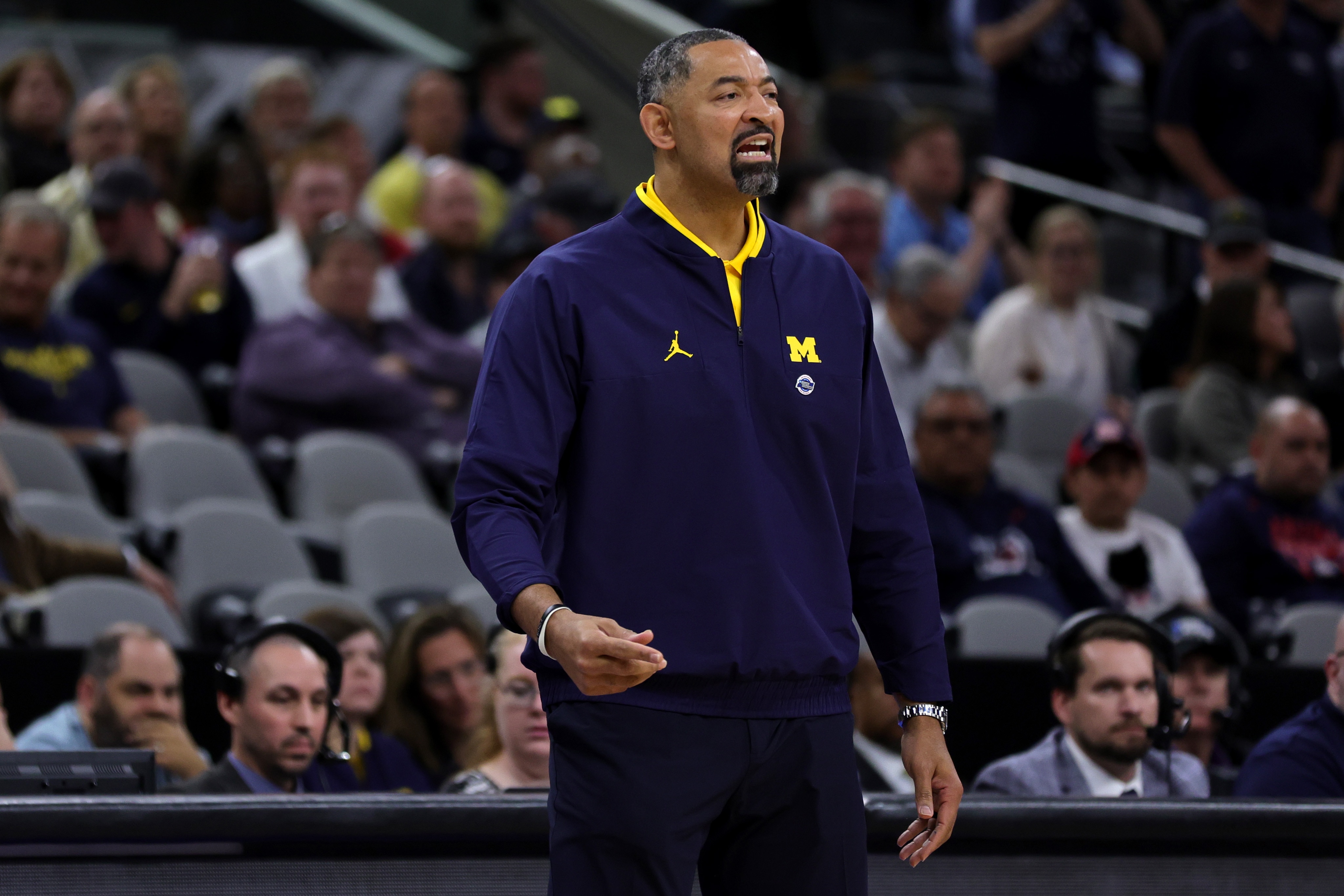 SAN ANTONIO, TEXAS - MARCH 24: Head coach Juwan Howard of the Michigan Wolverines directs his team during the first half of the NCAA Men's Basketball Tournament Sweet 16 Round game between the Michigan Wolverines and the Villanova Wildcats at AT&T Center on March 24, 2022 in San Antonio, Texas. (Photo by Carmen Mandato/Getty Images)