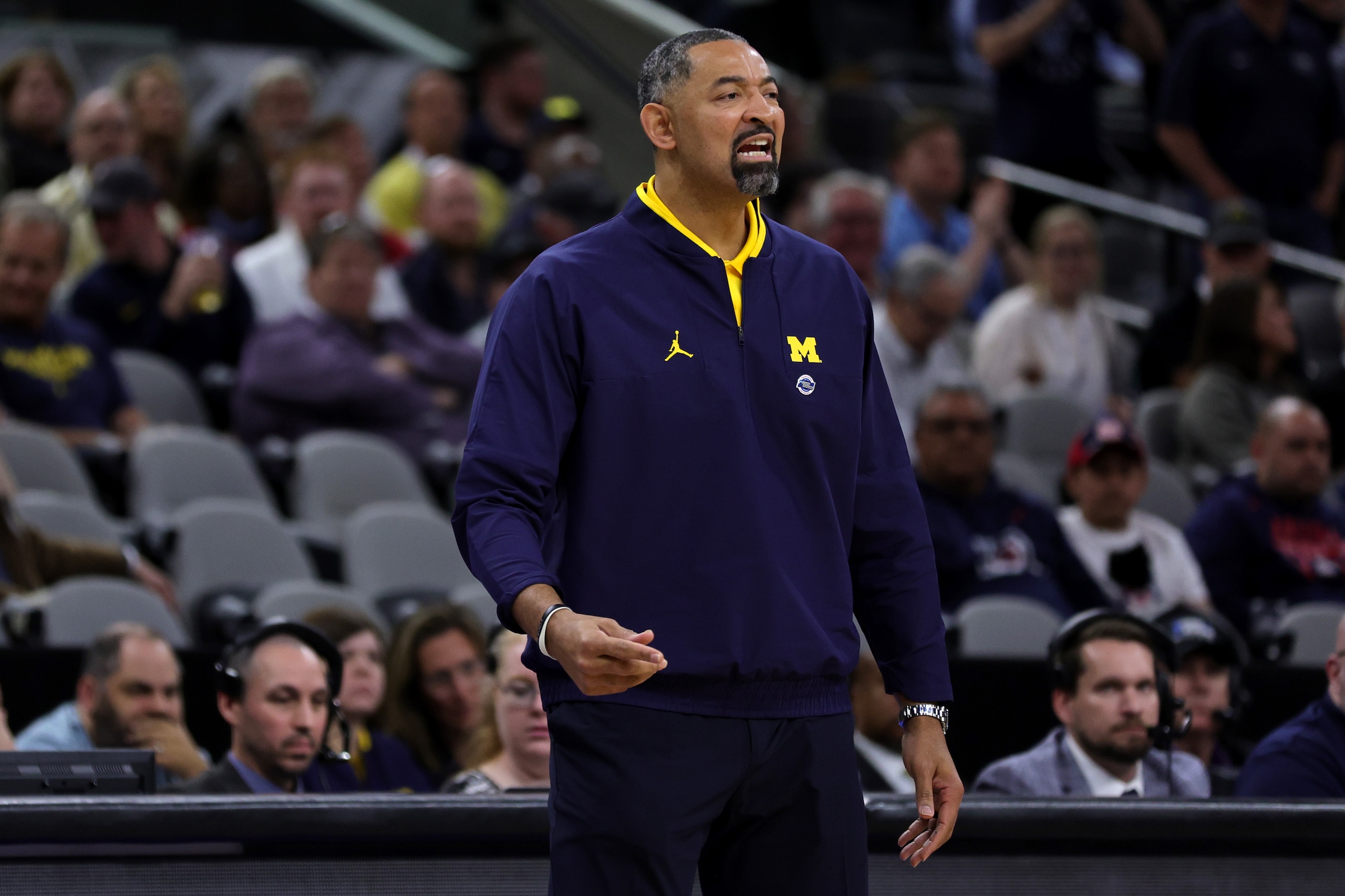 SAN ANTONIO, TEXAS - MARCH 24: Head coach Juwan Howard of the Michigan Wolverines directs his team during the first half of the NCAA Men's Basketball Tournament Sweet 16 Round game between the Michigan Wolverines and the Villanova Wildcats at AT&T Center on March 24, 2022 in San Antonio, Texas. (Photo by Carmen Mandato/Getty Images)
