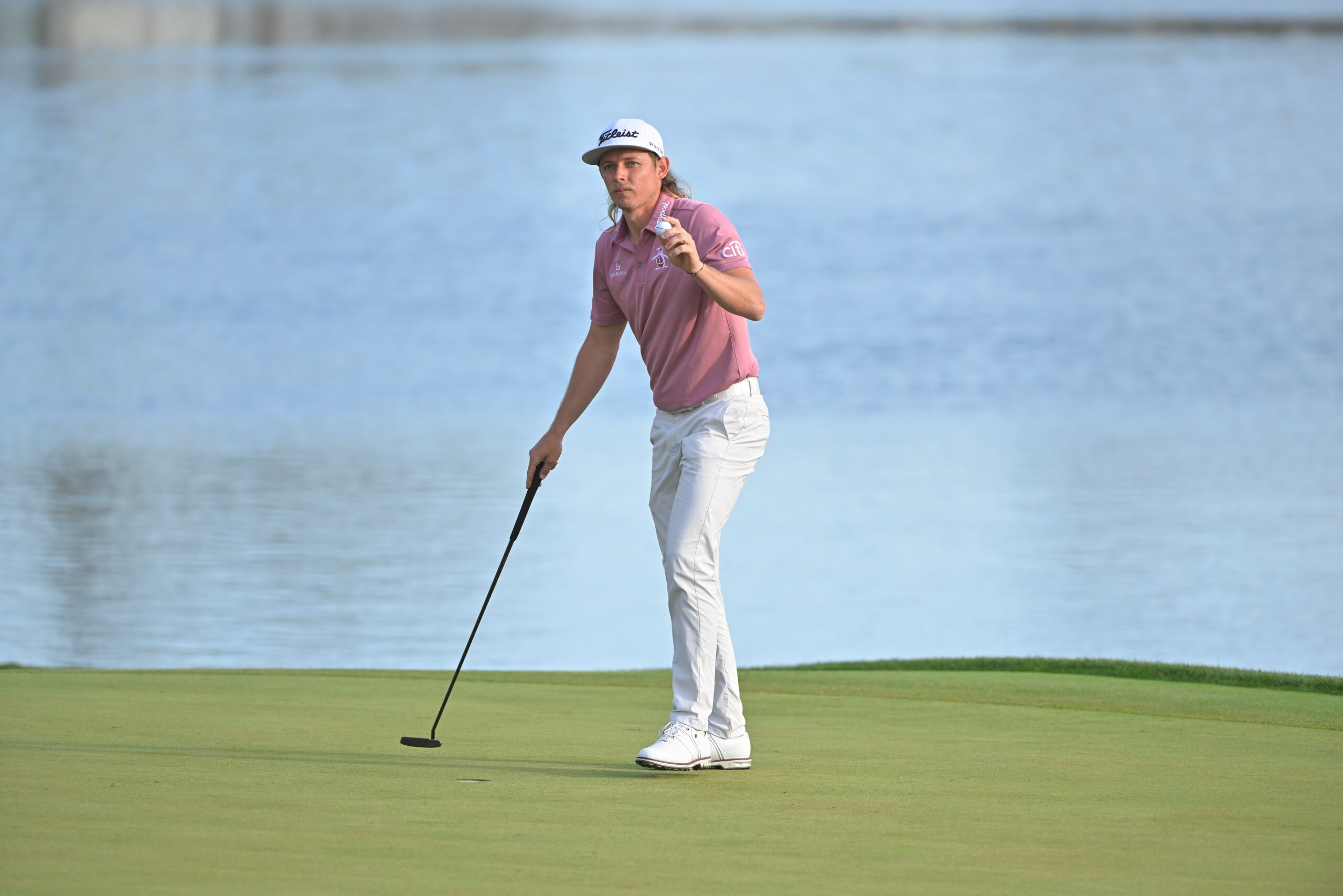 PONTE VEDRA BEACH, FL - MARCH 14: Cam Smith of Australia acknowledges the gallery on the 18th green during the final round of THE PLAYERS Championship on THE PLAYERS Stadium Course at TPC Sawgrass on March 14, 2022, in Ponte Vedra Beach Florida. (Photo by Ben Jared/PGA TOUR via Getty Images)