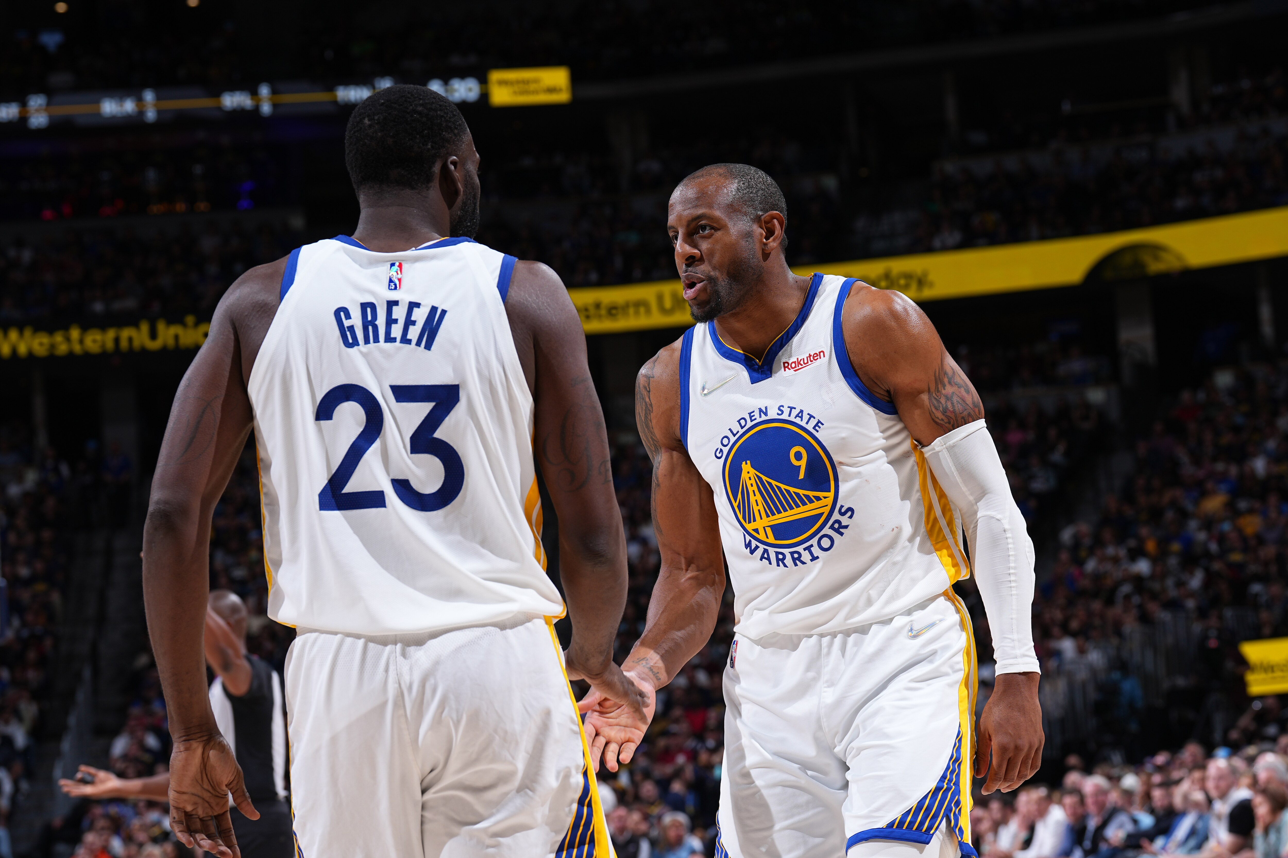 DENVER, CO - APRIL 21: Draymond Green #23 and Andre Iguodala #9 of the Golden State Warriors embrace during Round 1 Game 3 of the 2022 NBA Playoffs on April 21, 2022 at the Ball Arena in Denver, Colorado. NOTE TO USER: User expressly acknowledges and agrees that, by downloading and/or using this Photograph, user is consenting to the terms and conditions of the Getty Images License Agreement. Mandatory Copyright Notice: Copyright 2022 NBAE (Photo by Garrett Ellwood/NBAE via Getty Images)