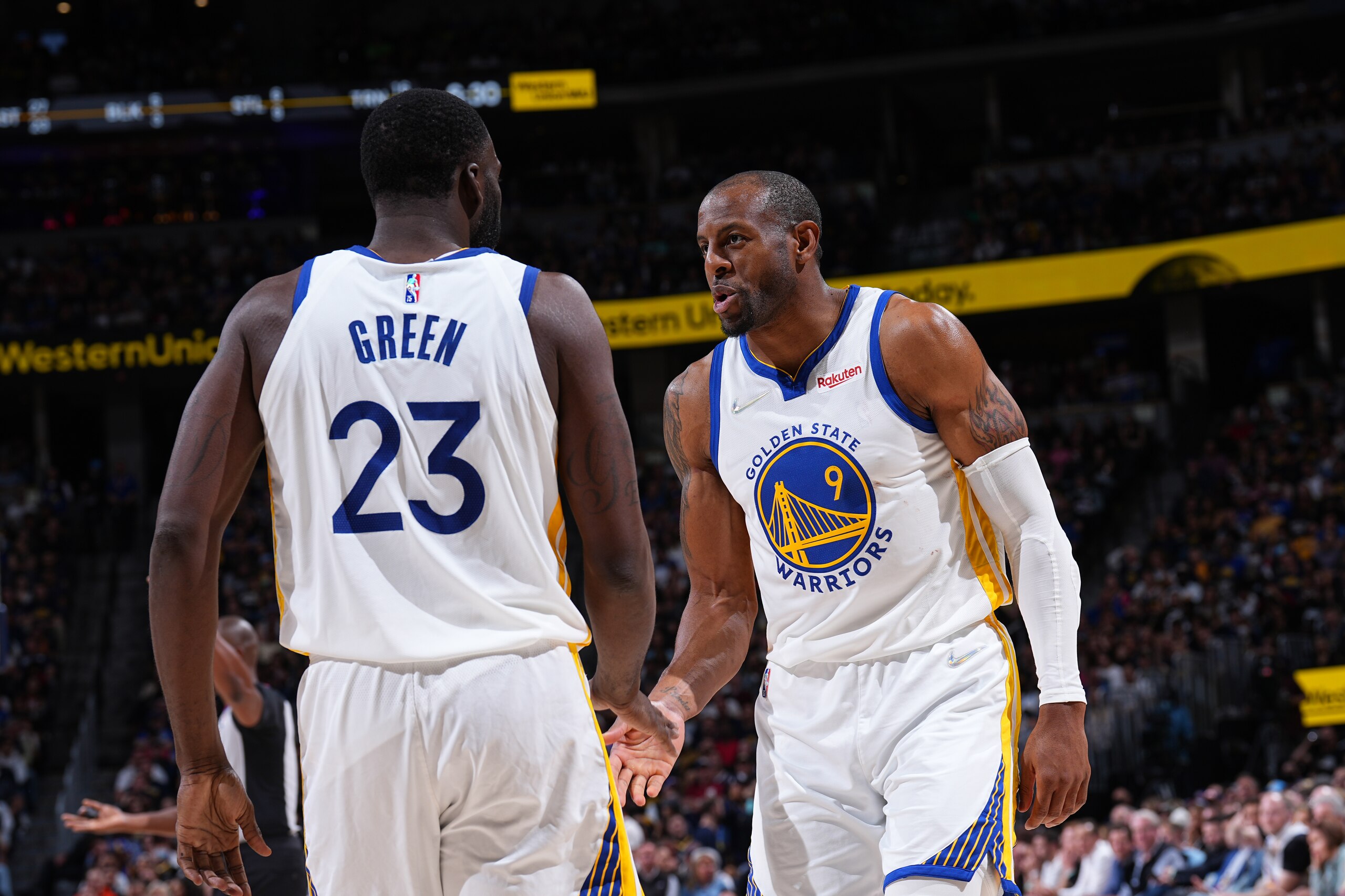 DENVER, CO - APRIL 21: Draymond Green #23 and Andre Iguodala #9 of the Golden State Warriors embrace during Round 1 Game 3 of the 2022 NBA Playoffs on April 21, 2022 at the Ball Arena in Denver, Colorado. NOTE TO USER: User expressly acknowledges and agrees that, by downloading and/or using this Photograph, user is consenting to the terms and conditions of the Getty Images License Agreement. Mandatory Copyright Notice: Copyright 2022 NBAE (Photo by Garrett Ellwood/NBAE via Getty Images)
