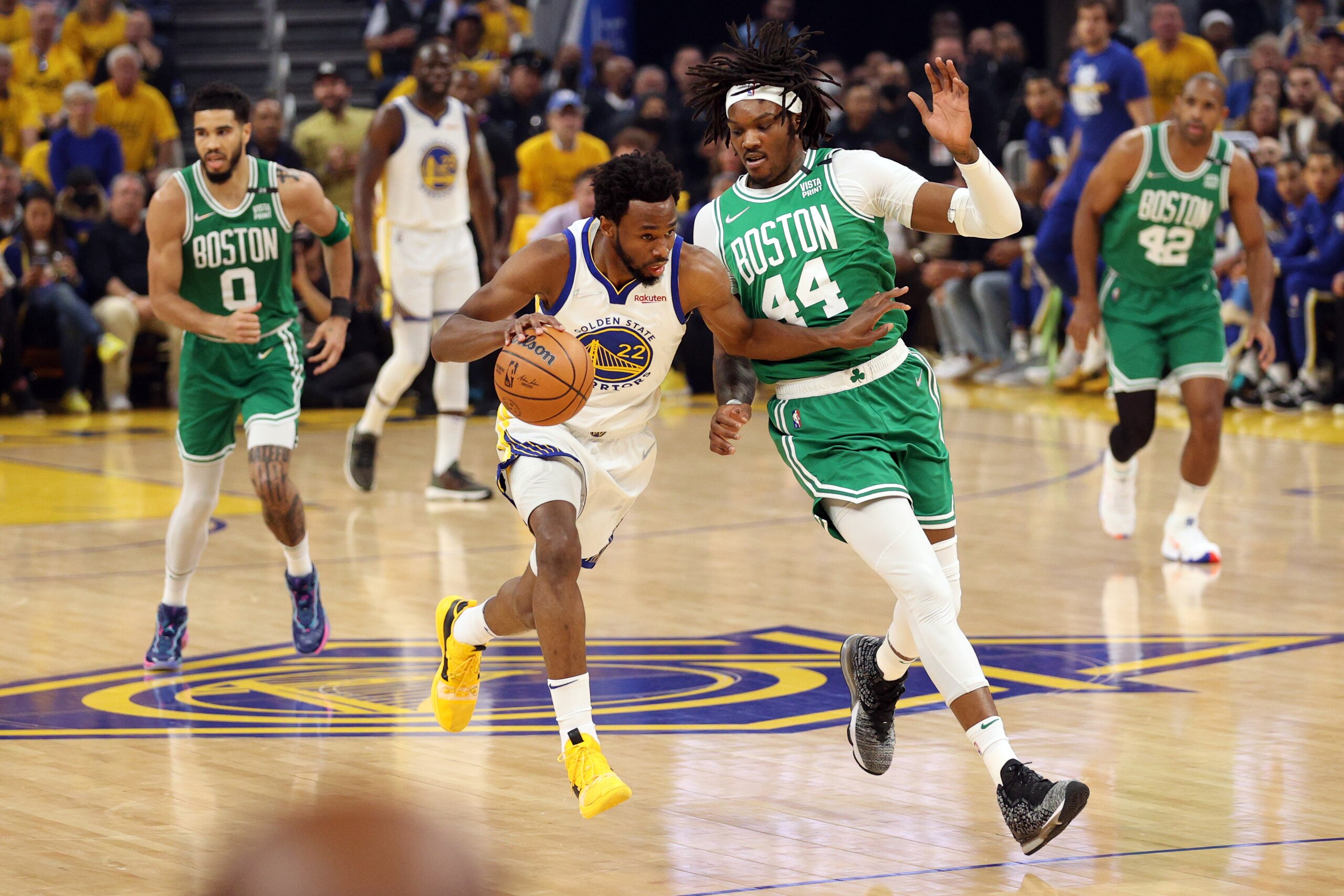 SAN FRANCISCO, CALIFORNIA - JUNE 02: Andrew Wiggins #22 of the Golden State Warriors dribbles against Robert Williams III #44 of the Boston Celtics during the first quarter in Game One of the 2022 NBA Finals at Chase Center on June 02, 2022 in San Francisco, California. NOTE TO USER: User expressly acknowledges and agrees that, by downloading and/or using this photograph, User is consenting to the terms and conditions of the Getty Images License Agreement. (Photo by Ezra Shaw/Getty Images)