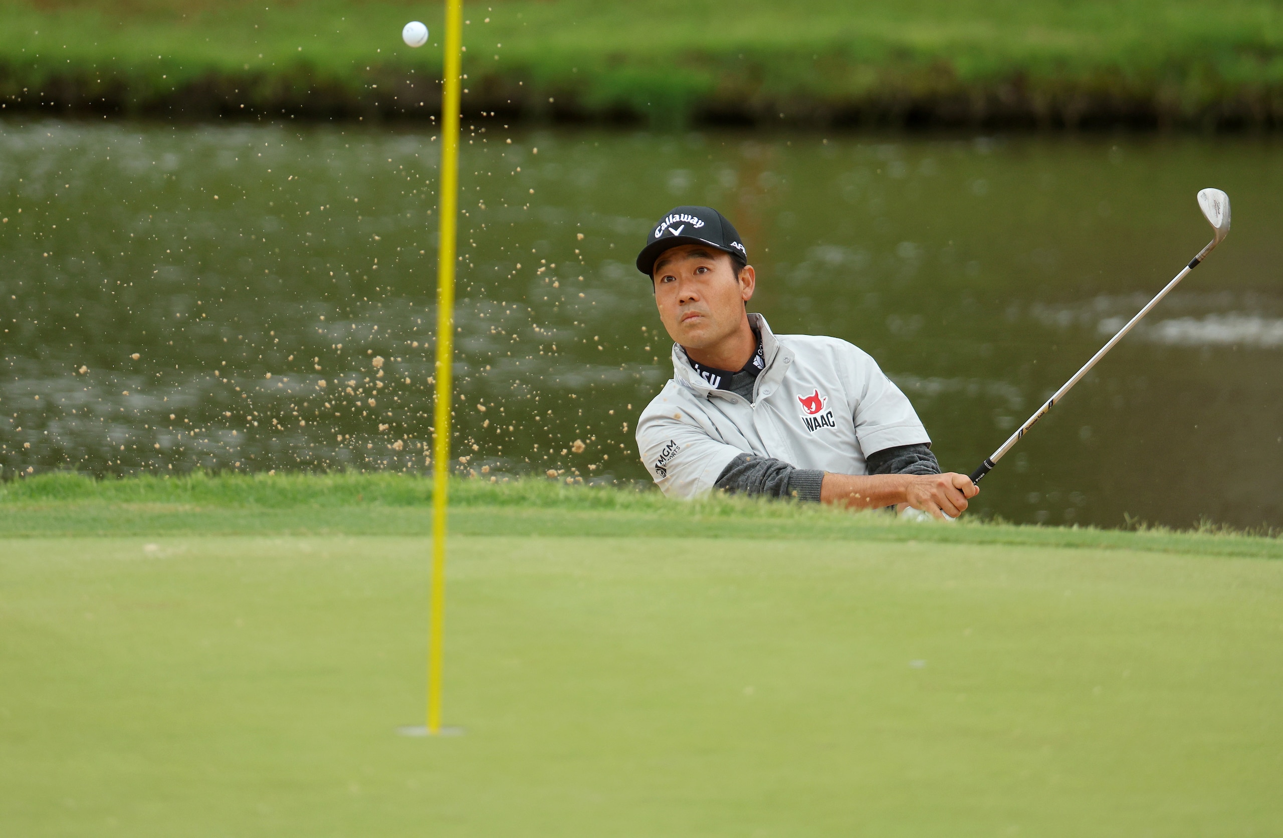 TULSA, OKLAHOMA - MAY 21: Kevin Na of the United States plays a shot from a bunker on the 13th hole during the third round of the 2022 PGA Championship at Southern Hills Country Club on May 21, 2022 in Tulsa, Oklahoma. (Photo by Andrew Redington/Getty Images)