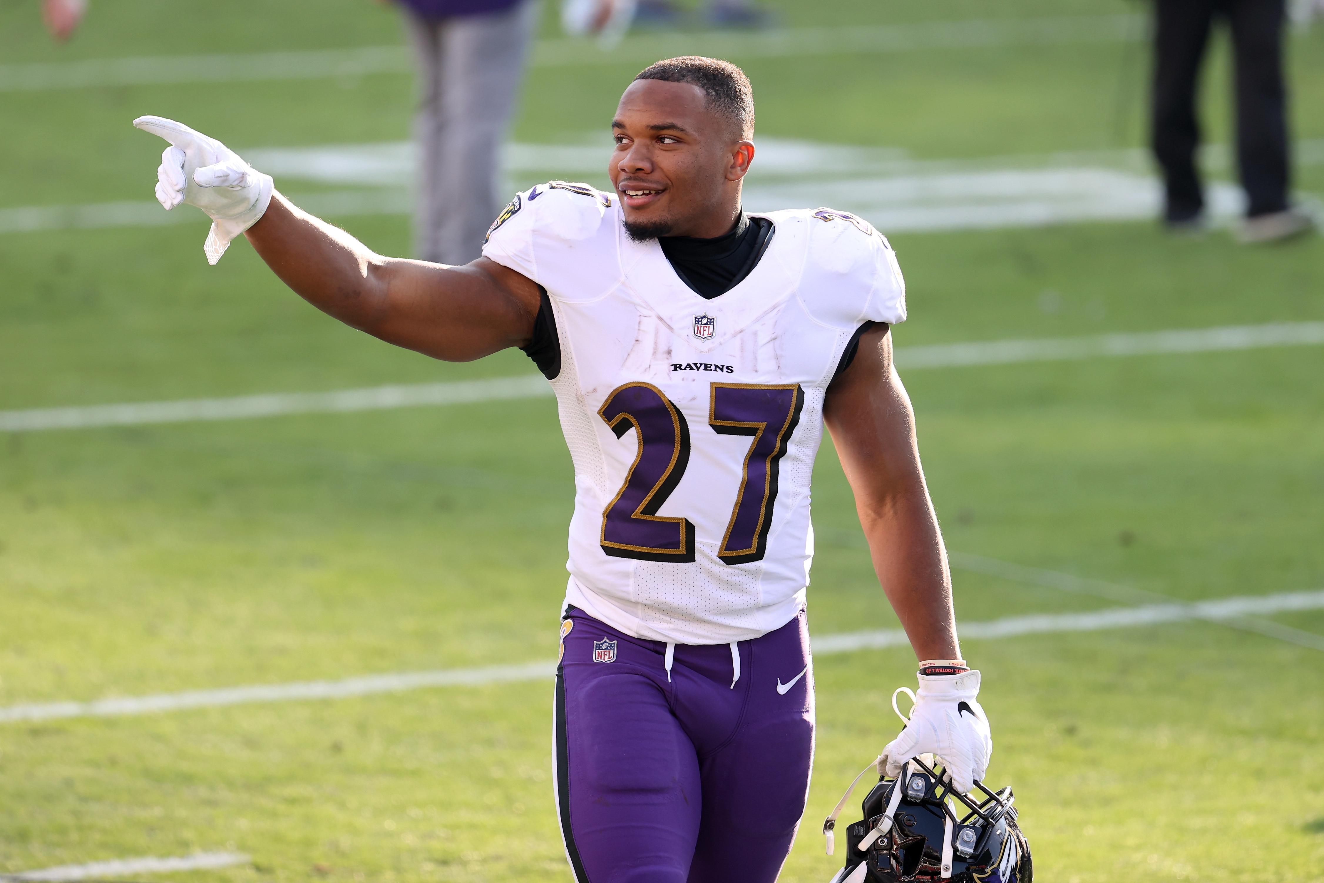 NASHVILLE, TENNESSEE - JANUARY 10: Running back J.K. Dobbins #27 of the Baltimore Ravens reacts after their 20-13 victory over the Tennessee Titans following their AFC Wild Card Playoff game at Nissan Stadium on January 10, 2021 in Nashville, Tennessee. (Photo by Andy Lyons/Getty Images)