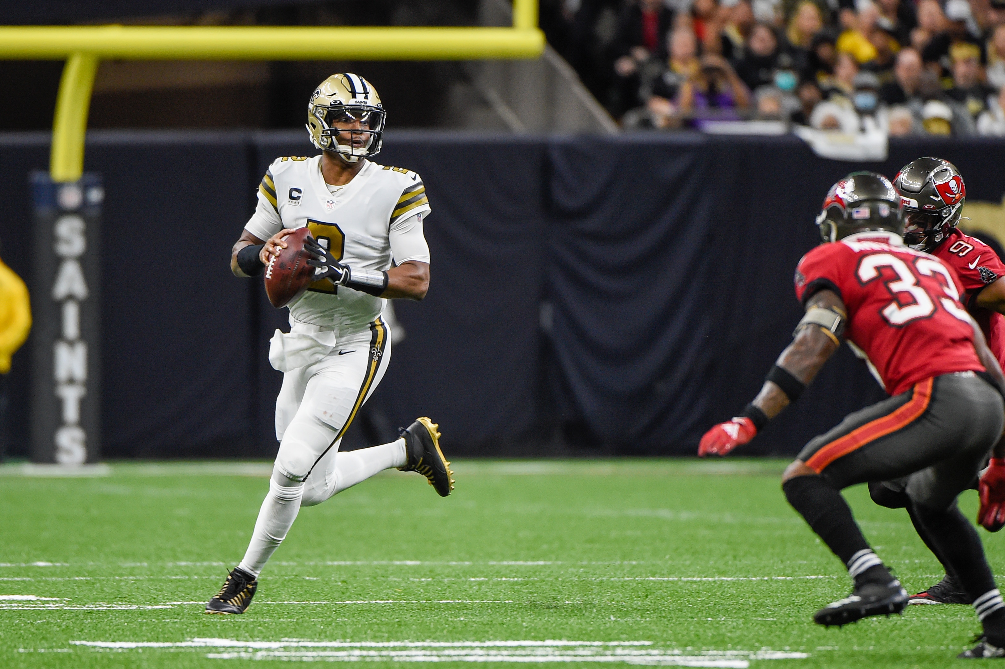 NEW ORLEANS, LA - OCTOBER 31: New Orleans Saints quarterback Jameis Winston (2) looks to throw as he rolls to his right during the football game between the Tampa Bay Buccaneers and New Orleans Saints at Caesar's Superdome on October 31, 2021 in New Orleans, LA. (Photo by Ken Murray/Icon Sportswire via Getty Images)