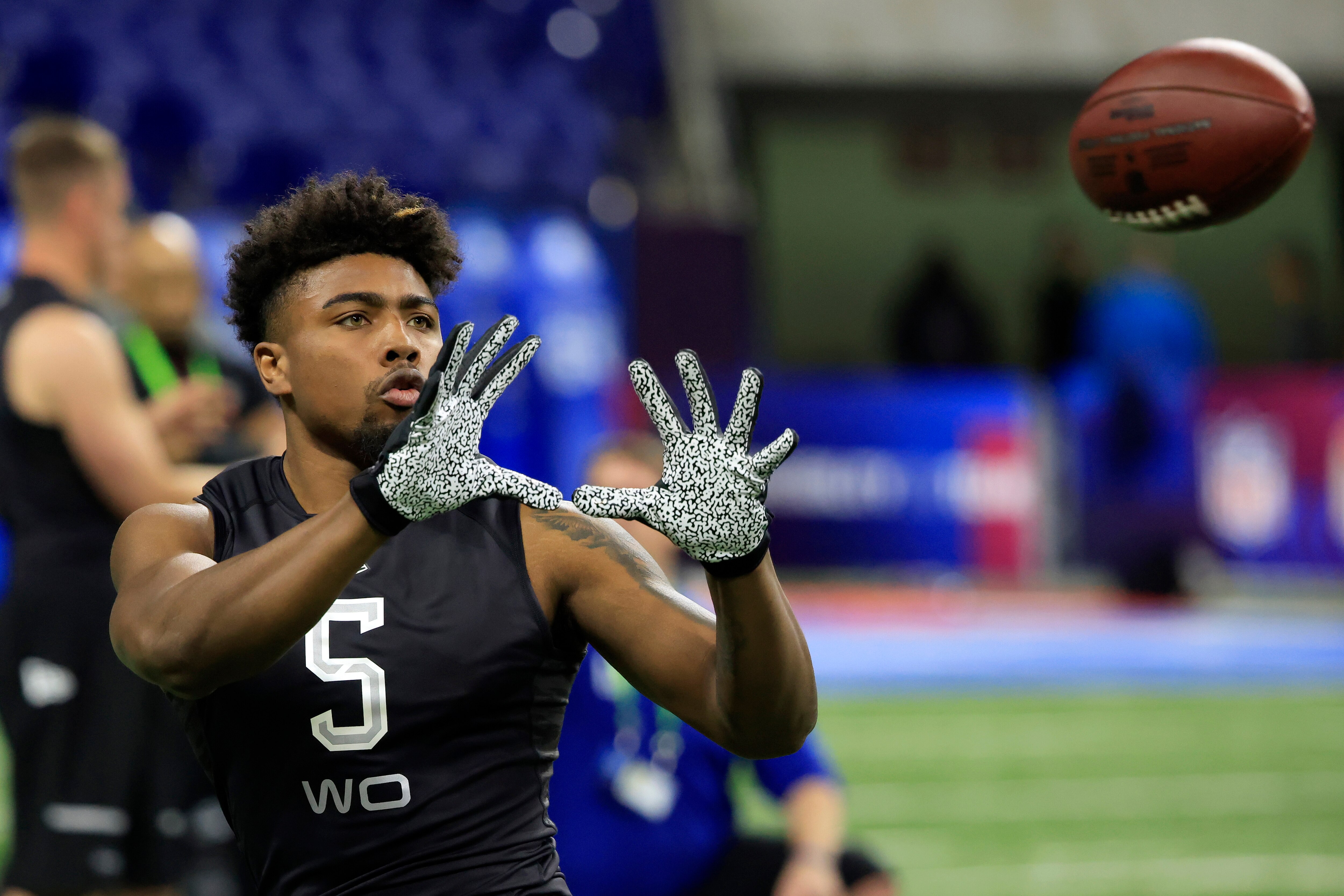 INDIANAPOLIS, INDIANA - MARCH 03: Treylon Burks #WO05 of Arkansas runs a drill during the NFL Combine at Lucas Oil Stadium on March 03, 2022 in Indianapolis, Indiana. (Photo by Justin Casterline/Getty Images)