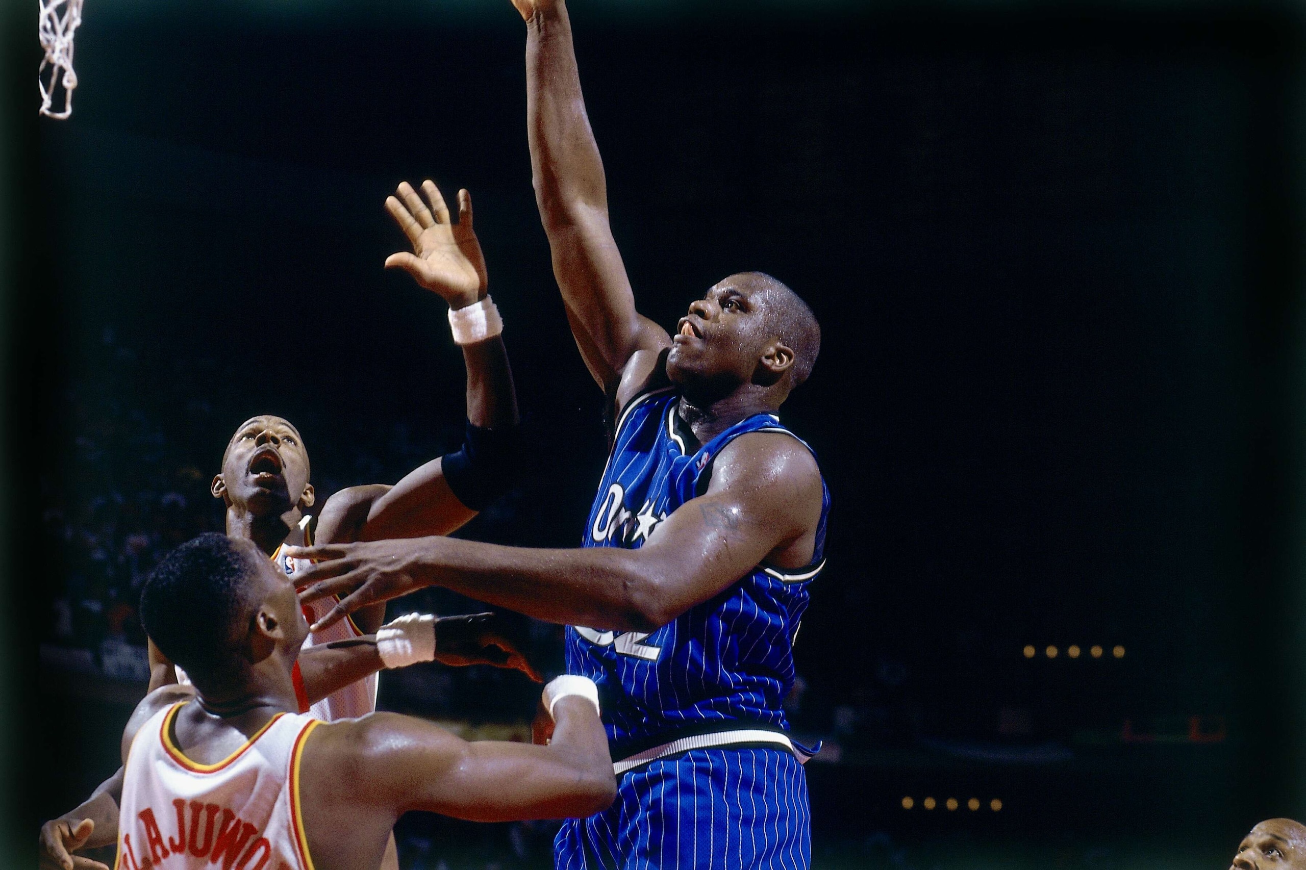 HOUSTON - JUNE 14:  Shaquille O'Neal #32 of the Orlando Magic attempts a shot against Hakeem Olajuwon #34 of the Houston Rockets in Game Four of the 1995 NBA Finals played June 14, 1995 at the Summit in Houston, Texas.  The Rockets won 113-101. NOTE TO USER: User expressly acknowledges that, by downloading and or using this photograph, User is consenting to the terms and conditions of the Getty Images License agreement. Mandatory Copyright Notice: Copyright 1995 NBAE (Photo by Nathaniel S. Butler/NBAE via Getty Images)