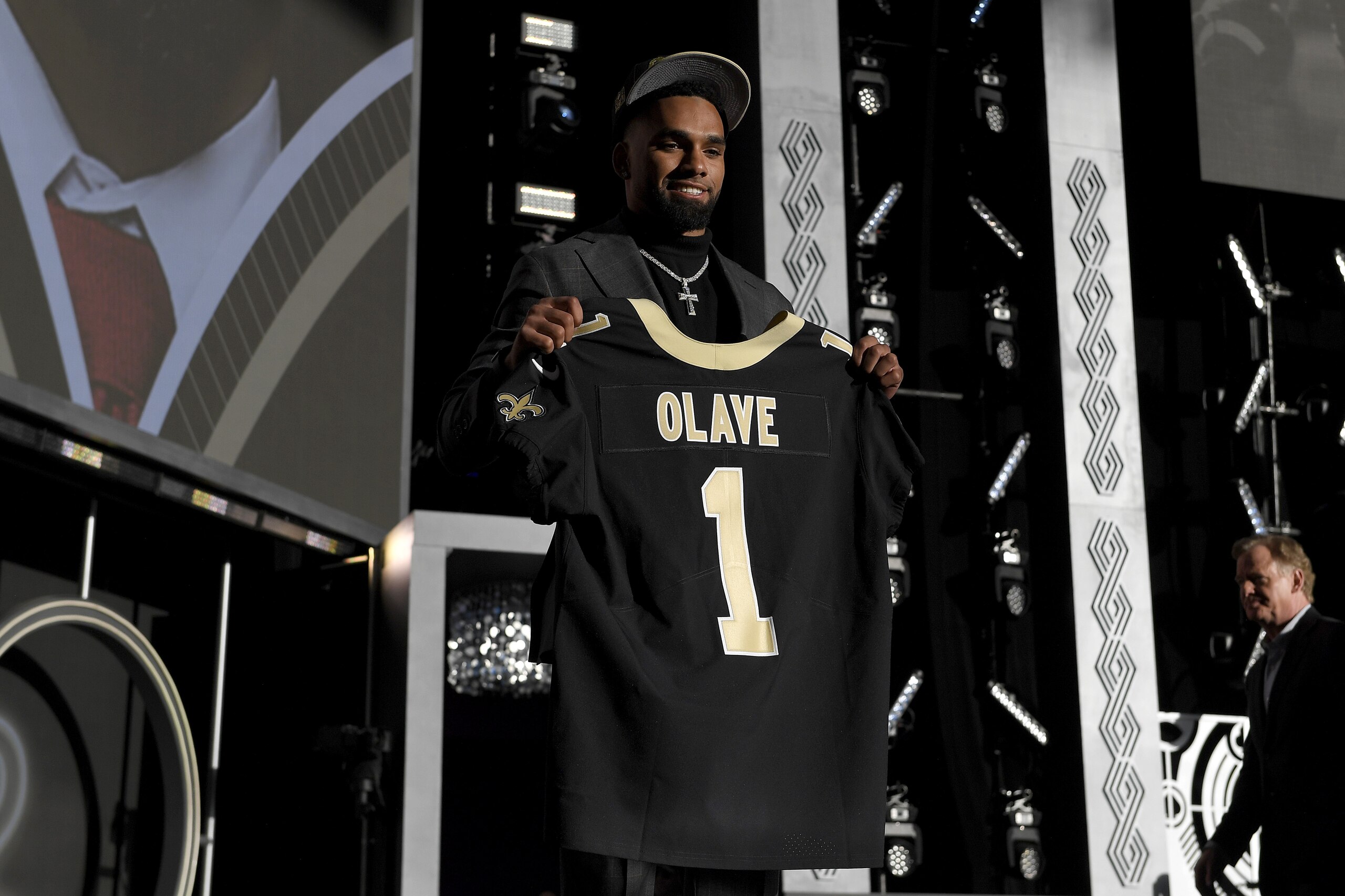 LAS VEGAS, NEVADA - APRIL 28: Chris Olave poses onstage after being selected 11th by the New Orleans Saints during round one of the 2022 NFL Draft on April 28, 2022 in Las Vegas, Nevada. (Photo by David Becker/Getty Images) LAS VEGAS, NEVADA - APRIL 28: Chris Olave poses onstage after being selected 11th by the New Orleans Saints during round one of the 2022 NFL Draft on April 28, 2022 in Las Vegas, Nevada. (Photo by David Becker/Getty Images)
