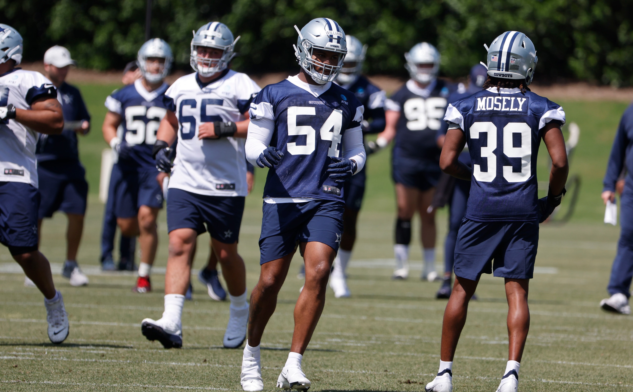 Dallas Cowboys defensive end Sam Williams (54) goes through drills during the NFL football team's rookie minicamp in Frisco, Texas, Friday, May 13, 2022. (AP Photo/Michael Ainsworth) Dallas Cowboys defensive end Sam Williams (54) goes through drills during the NFL football team's rookie minicamp in Frisco, Texas, Friday, May 13, 2022. (AP Photo/Michael Ainsworth)