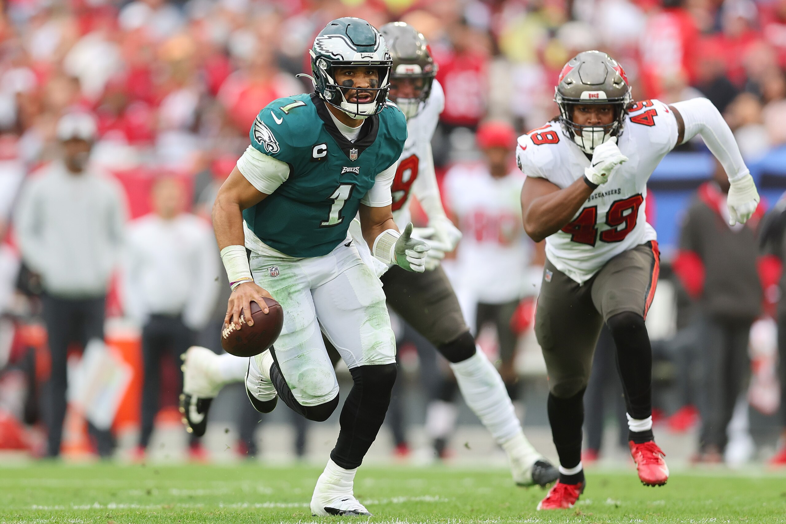 TAMPA, FLORIDA - JANUARY 16: Jalen Hurts #1 of the Philadelphia Eagles scrambles with the ball against the Tampa Bay Buccaneers in the second half of the NFC Wild Card Playoff game at Raymond James Stadium on January 16, 2022 in Tampa, Florida.  (Photo by Michael Reaves/Getty Images)
