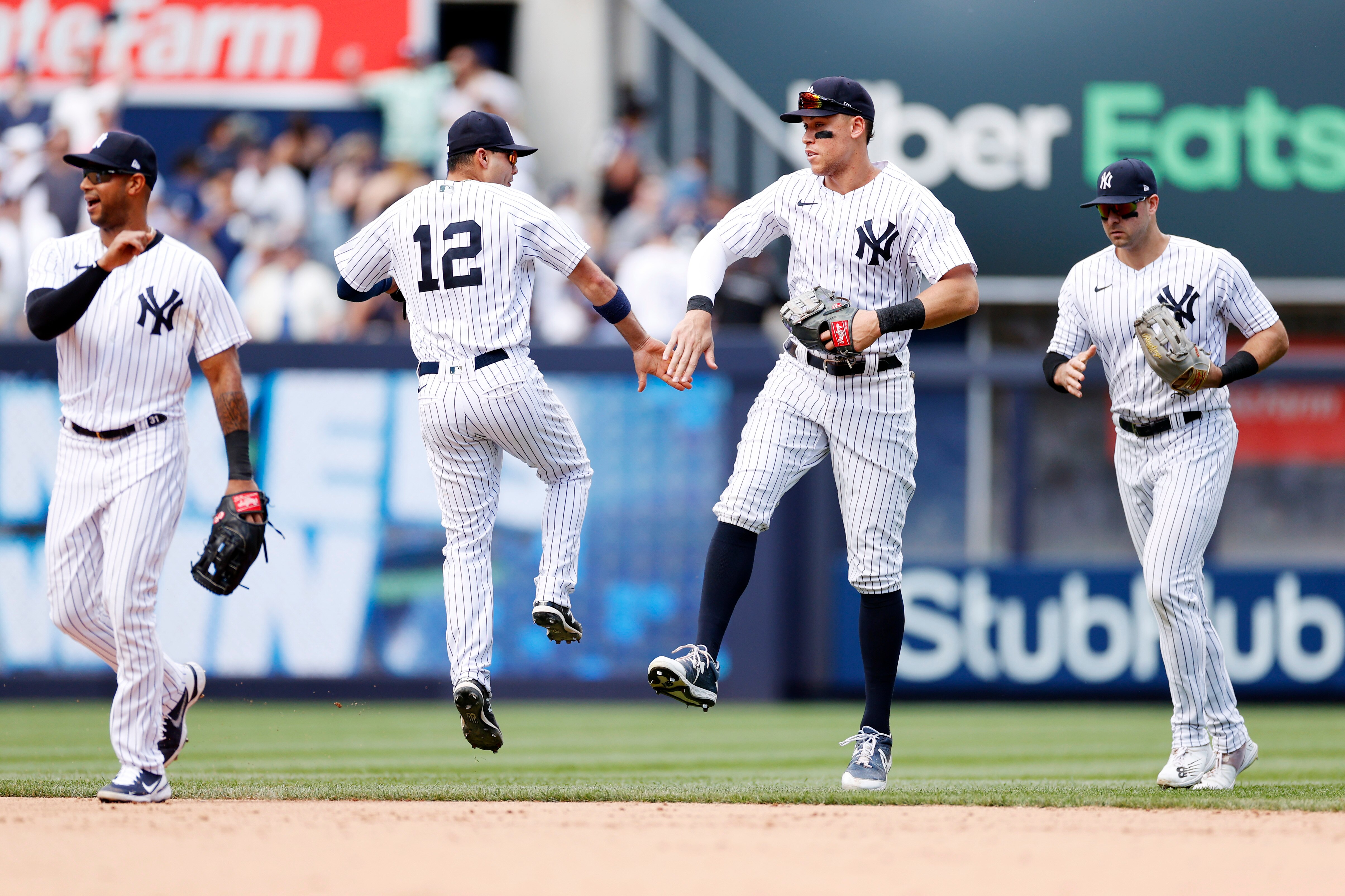 NEW YORK, NEW YORK - JUNE 04: Aaron Hicks #31, Isiah Kiner-Falefa #12, Aaron Judge #99, and Joey Gallo #13 of the New York Yankees celebrate during the ninth inning against the Detroit Tigers at Yankee Stadium on June 04, 2022 in the Bronx borough of New York City. The Yankees won 3-0. (Photo by Sarah Stier/Getty Images)