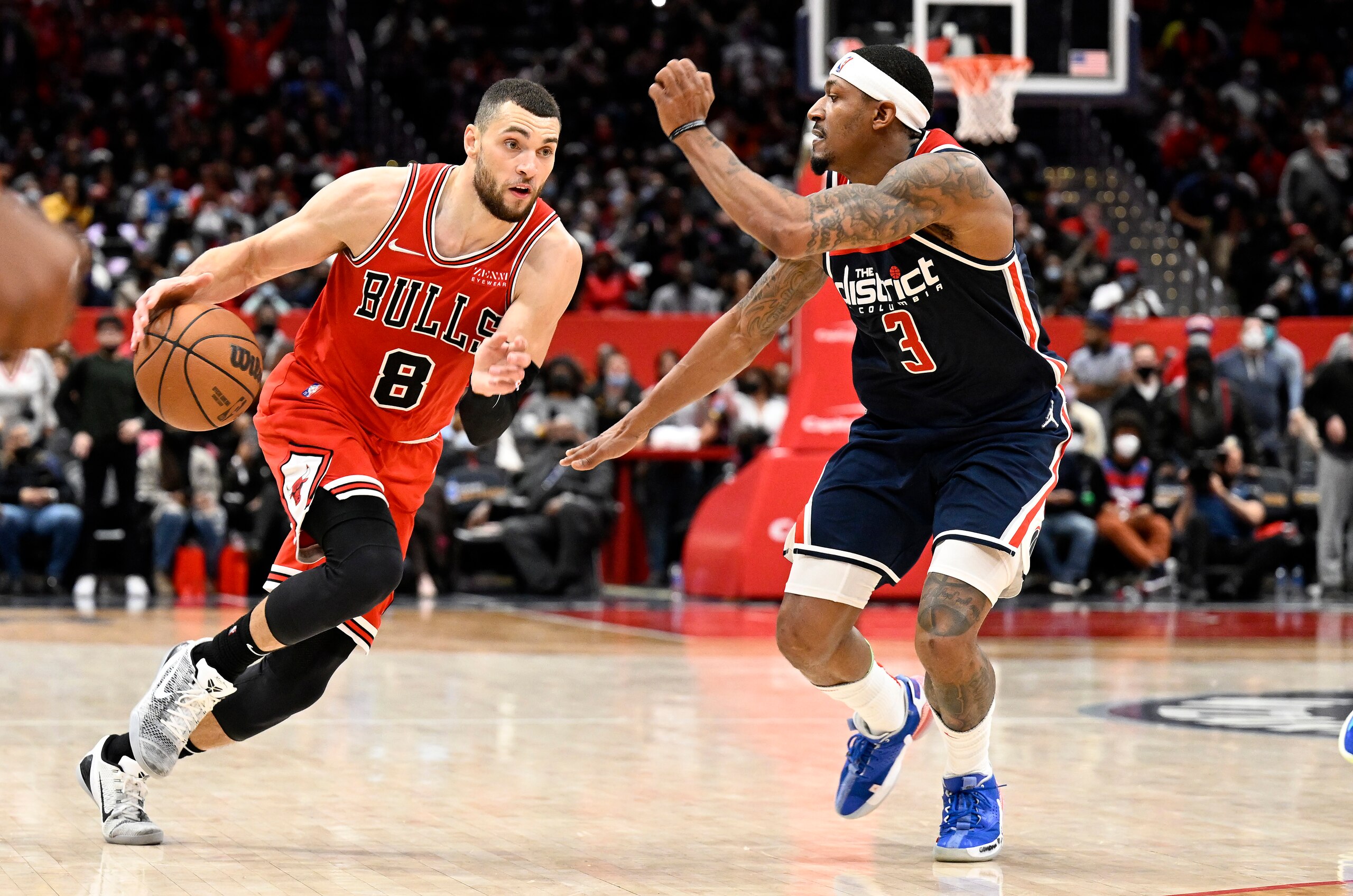 WASHINGTON, DC - JANUARY 01: Zach LaVine #8 of the Chicago Bulls handles the ball in the second half against Bradley Beal #3 of the Washington Wizards at Capital One Arena on January 01, 2022 in Washington, DC.  NOTE TO USER: User expressly acknowledges and agrees that, by downloading and or using this photograph, User is consenting to the terms and conditions of the Getty Images License Agreement. (Photo by G Fiume/Getty Images)