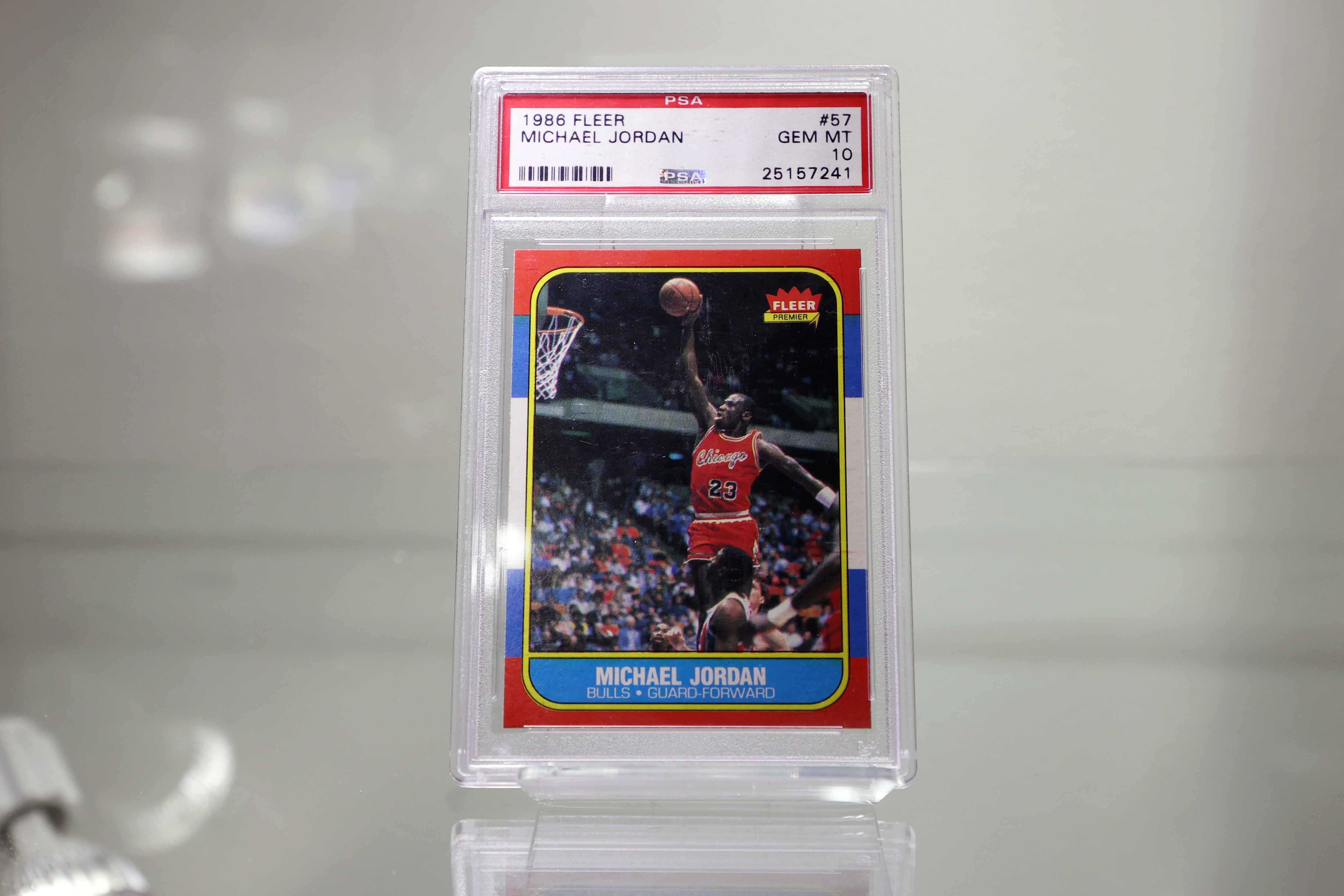 NEW YORK, NEW YORK - JULY 21: 1986/87 Fleer #57 Michael Jordan Rookie Card | PSA/DNA GEM MT 10 is on display during a press preview of The Olympic Collection at Sotheby's on July 21, 2021 in New York City. (Photo by Cindy Ord/Getty Images)