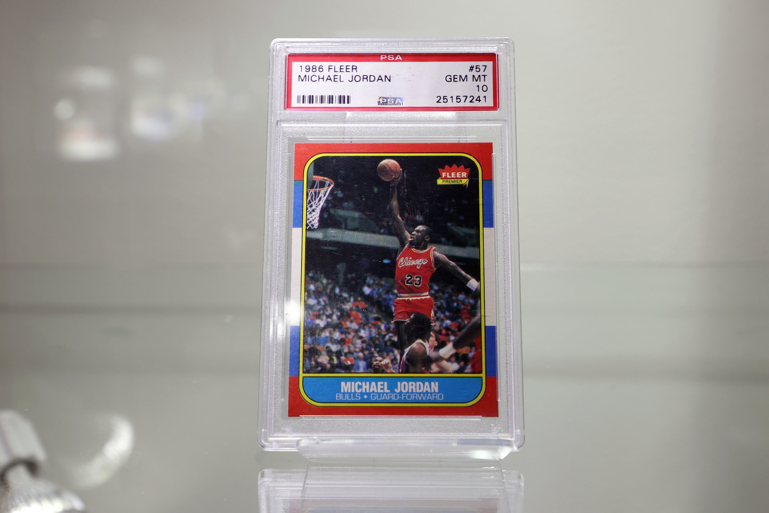 NEW YORK, NEW YORK - JULY 21: 1986/87 Fleer #57 Michael Jordan Rookie Card | PSA/DNA GEM MT 10 is on display during a press preview of The Olympic Collection at Sotheby's on July 21, 2021 in New York City. (Photo by Cindy Ord/Getty Images)