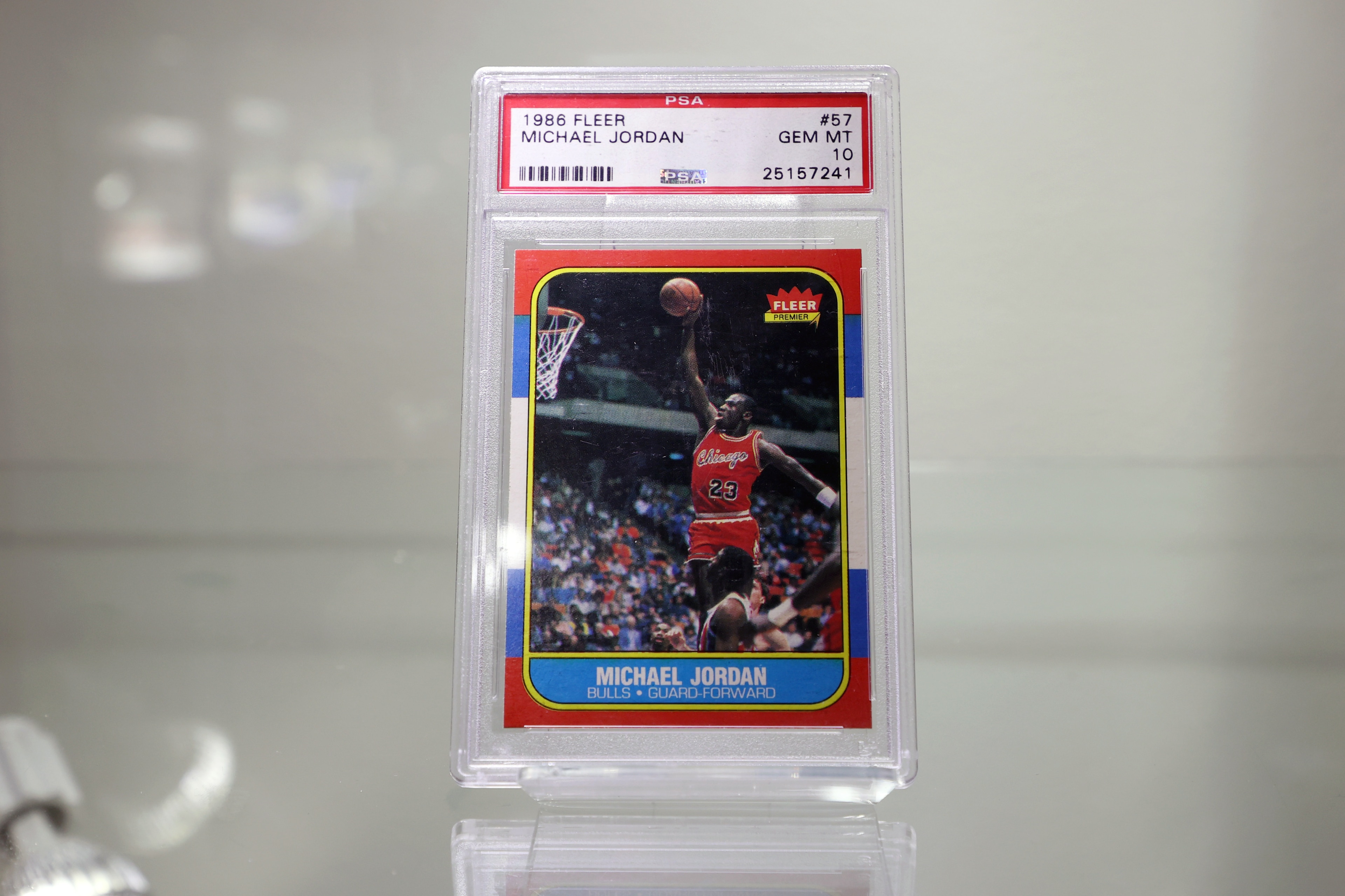 NEW YORK, NEW YORK - JULY 21: 1986/87 Fleer #57 Michael Jordan Rookie Card | PSA/DNA GEM MT 10 is on display during a press preview of The Olympic Collection at Sotheby's on July 21, 2021 in New York City. (Photo by Cindy Ord/Getty Images)