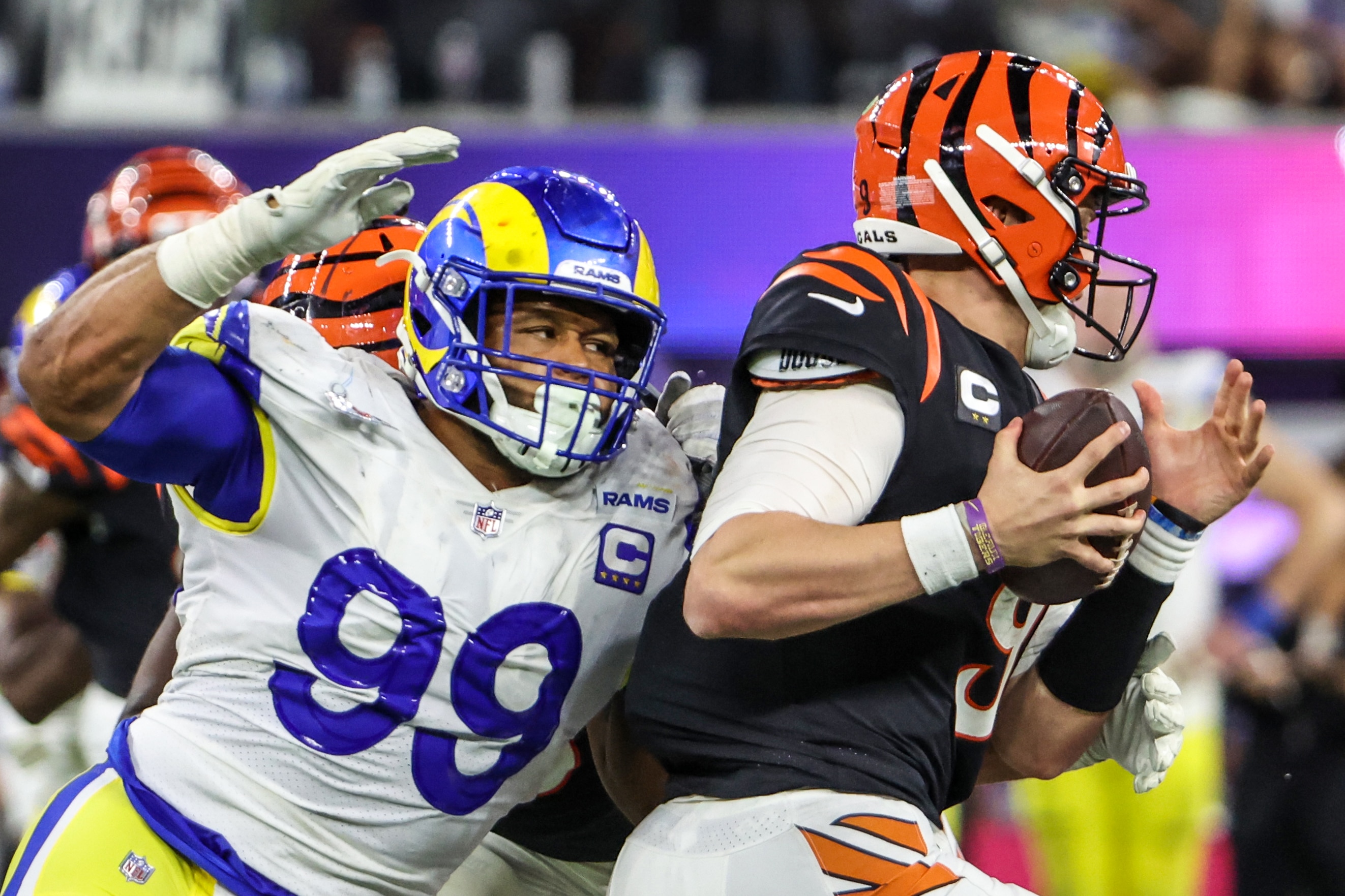 Inglewood, CA, Sunday, February 13, 2022 - Rams defensive lineman Aaron Donald closes in on a sack of Bengals quarterback Joe Burrow to seal a 23-20 win in Super Bowl LVI at SoFi Stadium.  (Robert Gauthier/Los Angeles Times via Getty Images)
