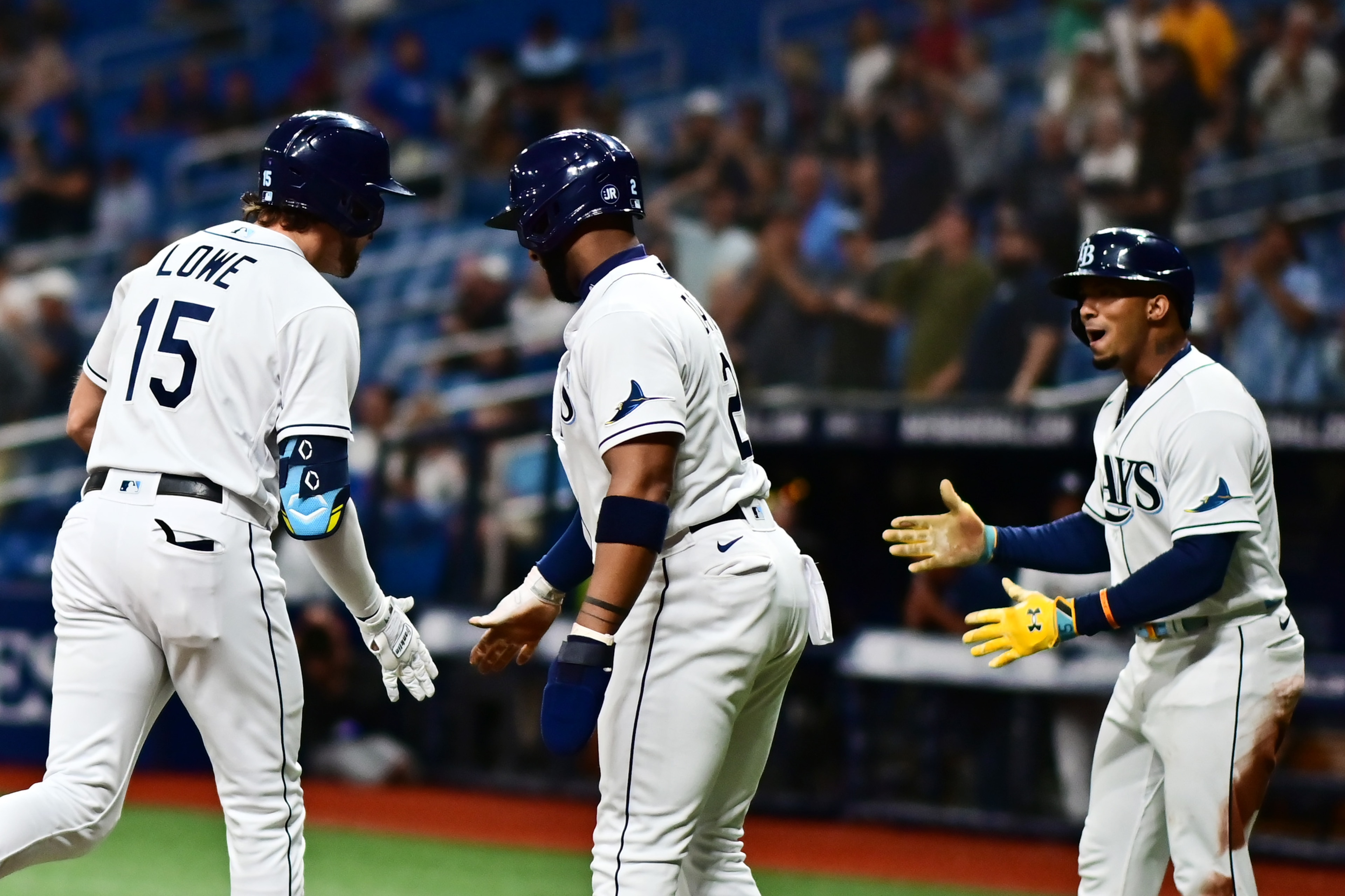 ST PETERSBURG, FLORIDA - APRIL 29: Josh Lowe #15 of the Tampa Bay Rays is congratulated by Wander Franco #5 and Yandy Diaz #2 after hitting a three run home run in the first inning against the Minnesota Twins at Tropicana Field on April 29, 2022 in St Petersburg, Florida. (Photo by Julio Aguilar/Getty Images) ST PETERSBURG, FLORIDA - APRIL 29: Josh Lowe #15 of the Tampa Bay Rays is congratulated by Wander Franco #5 and Yandy Diaz #2 after hitting a three run home run in the first inning against the Minnesota Twins at Tropicana Field on April 29, 2022 in St Petersburg, Florida. (Photo by Julio Aguilar/Getty Images)