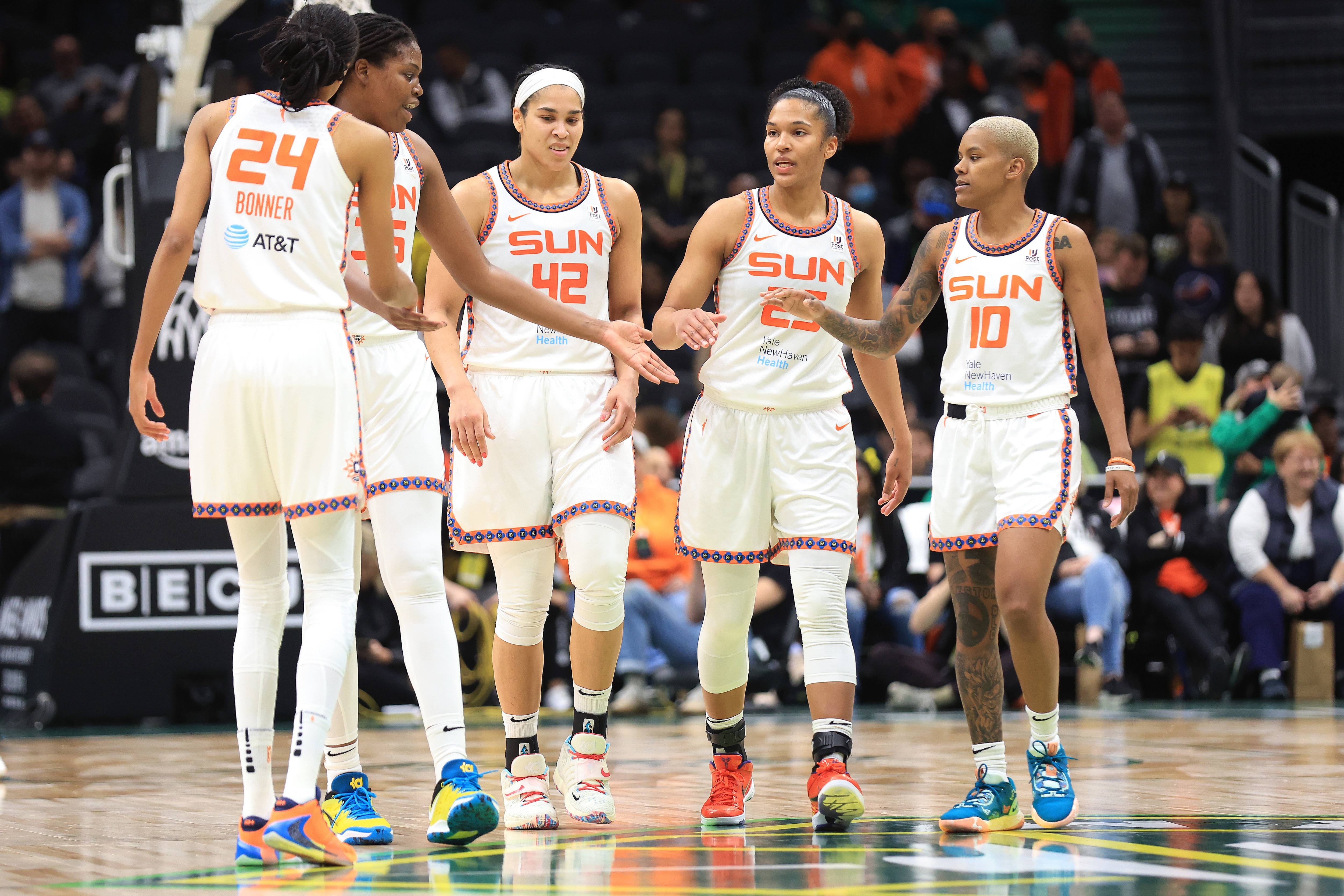 SEATTLE, WASHINGTON - JUNE 05: (L-R) DeWanna Bonner #24, Jonquel Jones #35, Brionna Jones #42, Alyssa Thomas #25 and Courtney Williams #10 of the Connecticut Sun embrace during the fourth quarter against the Seattle Storm at Climate Pledge Arena on June 05, 2022 in Seattle, Washington.  NOTE TO USER: User expressly acknowledges and agrees that, by downloading and or using this photograph, User is consenting to the terms and conditions of the Getty Images License Agreement. (Photo by Abbie Parr/Getty Images)