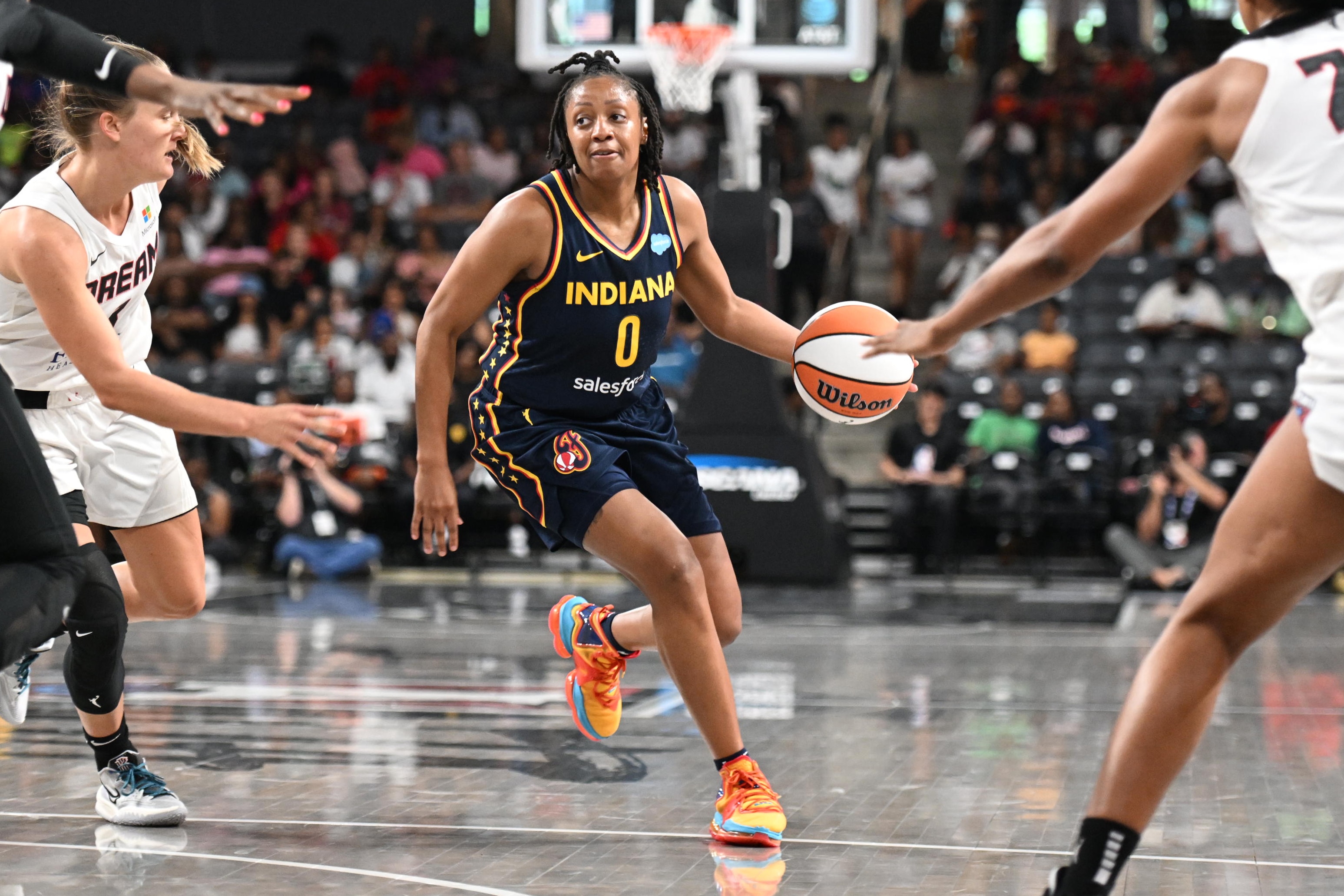 COLLEGE PARK, GA - JUNE 5: Kelsey Mitchell #0 of the Indiana Fever dribbles the ball during the game against the Atlanta Dream on June 5, 2022 at Gateway Center Arena in College Park, Georgia.  NOTE TO USER: User expressly acknowledges and agrees that, by downloading and/or using this Photograph, user is consenting to the terms and conditions of the Getty Images License Agreement. Mandatory Copyright Notice: Copyright 2022 NBAE (Photo by Adam Hagy/NBAE via Getty Images)