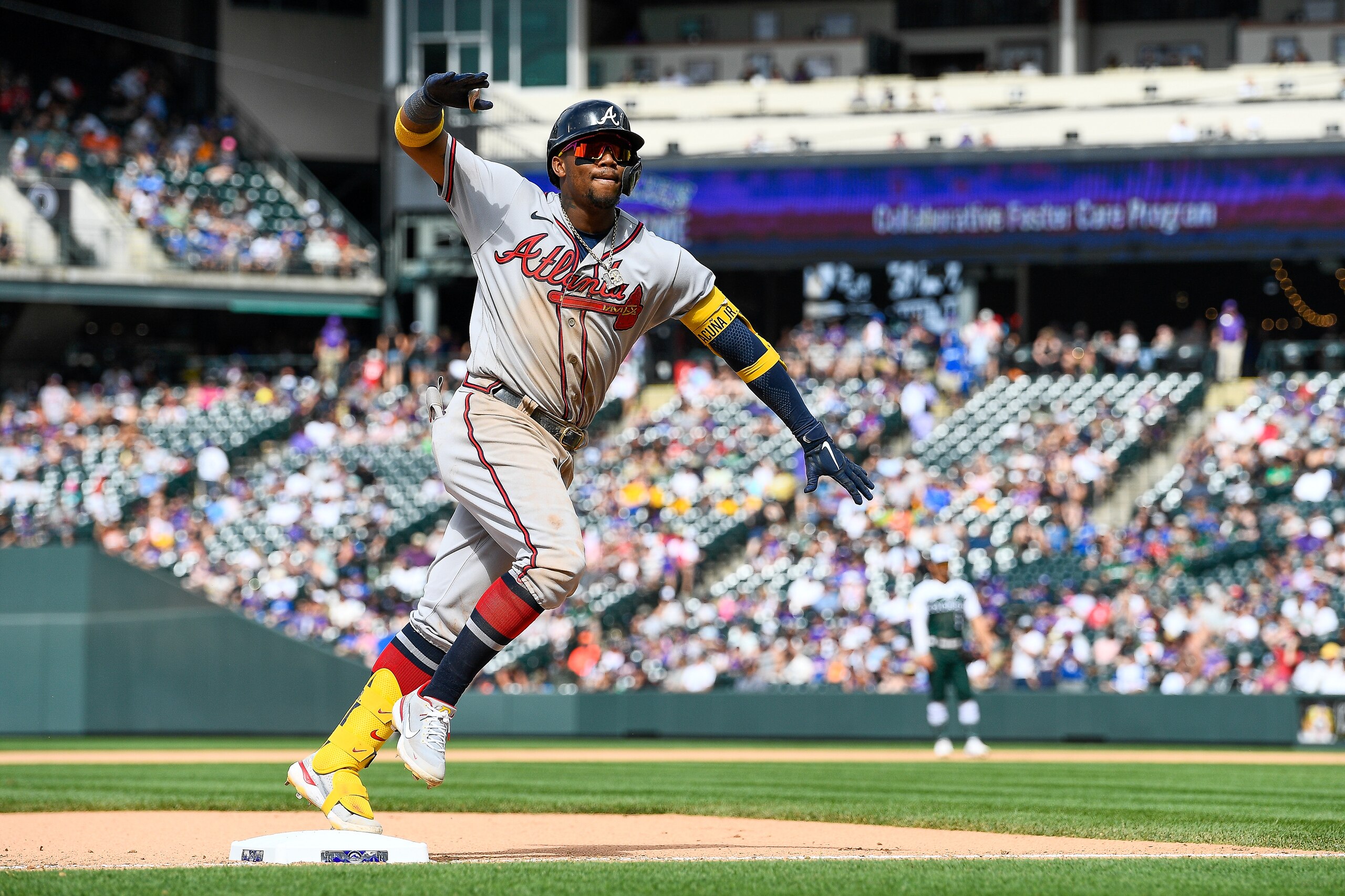 DENVER, CO - JUNE 5: Ronald Acuna Jr. #13 of the Atlanta Braves rounds the bases after hitting an eighth inning solo home run against the Colorado Rockies at Coors Field on June 5, 2022 in Denver, Colorado. (Photo by Dustin Bradford/Getty Images) DENVER, CO - JUNE 5: Ronald Acuna Jr. #13 of the Atlanta Braves rounds the bases after hitting an eighth inning solo home run against the Colorado Rockies at Coors Field on June 5, 2022 in Denver, Colorado. (Photo by Dustin Bradford/Getty Images)