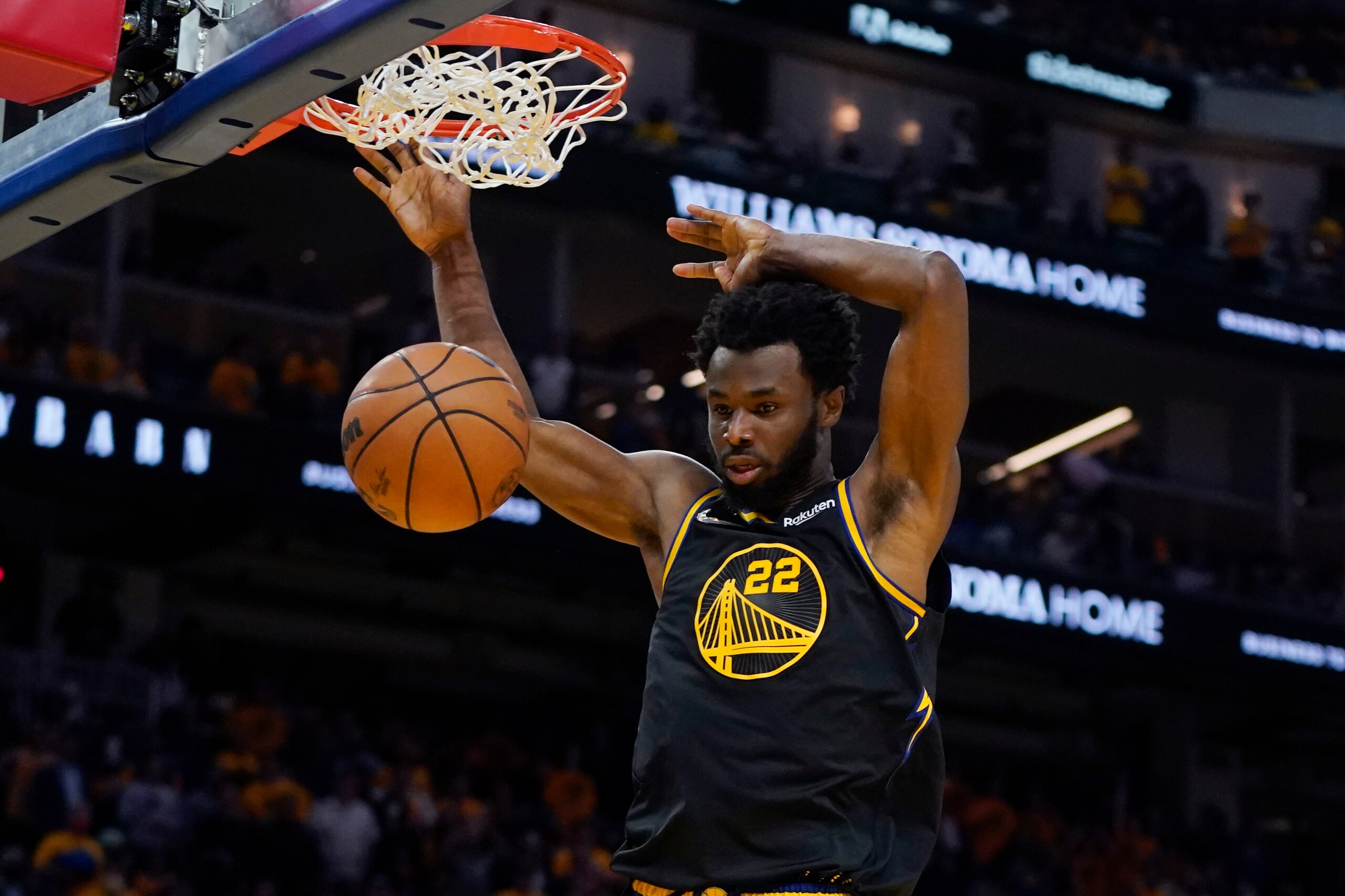 Golden State Warriors forward Andrew Wiggins dunks against the Dallas Mavericks during the second half in Game 5 of the NBA basketball playoffs Western Conference finals in San Francisco, Thursday, May 26, 2022. (AP Photo/Jeff Chiu)