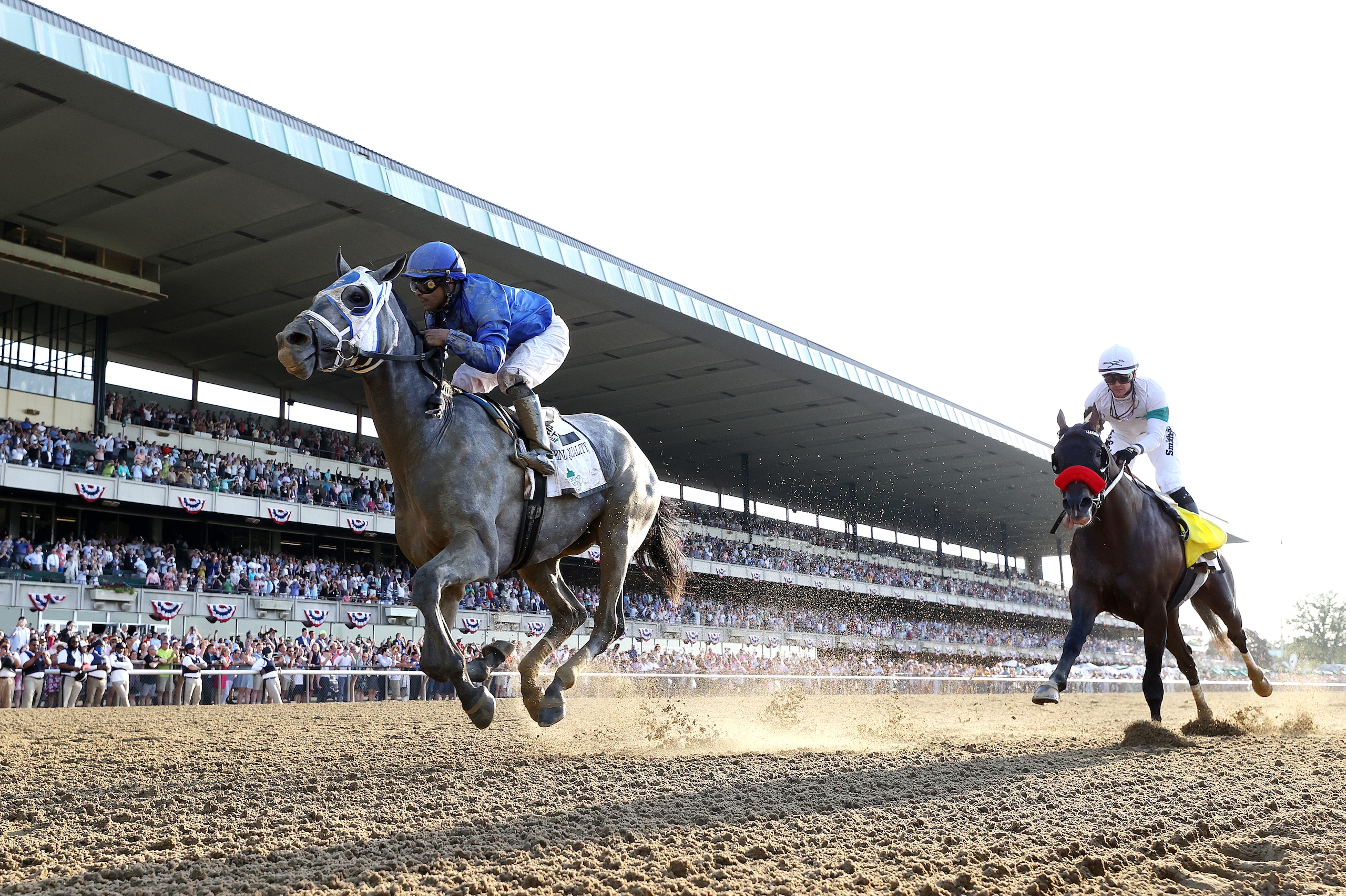 ELMONT, NEW YORK - JUNE 05:  Essential Quality with Luis Saez up wins the 153rd running of the Belmont Stakes as Hot Rod Charlie with Flavien Prat up finishes second  at Belmont Park on June 05, 2021 in Elmont, New York. (Photo by Al Bello/Getty Images)