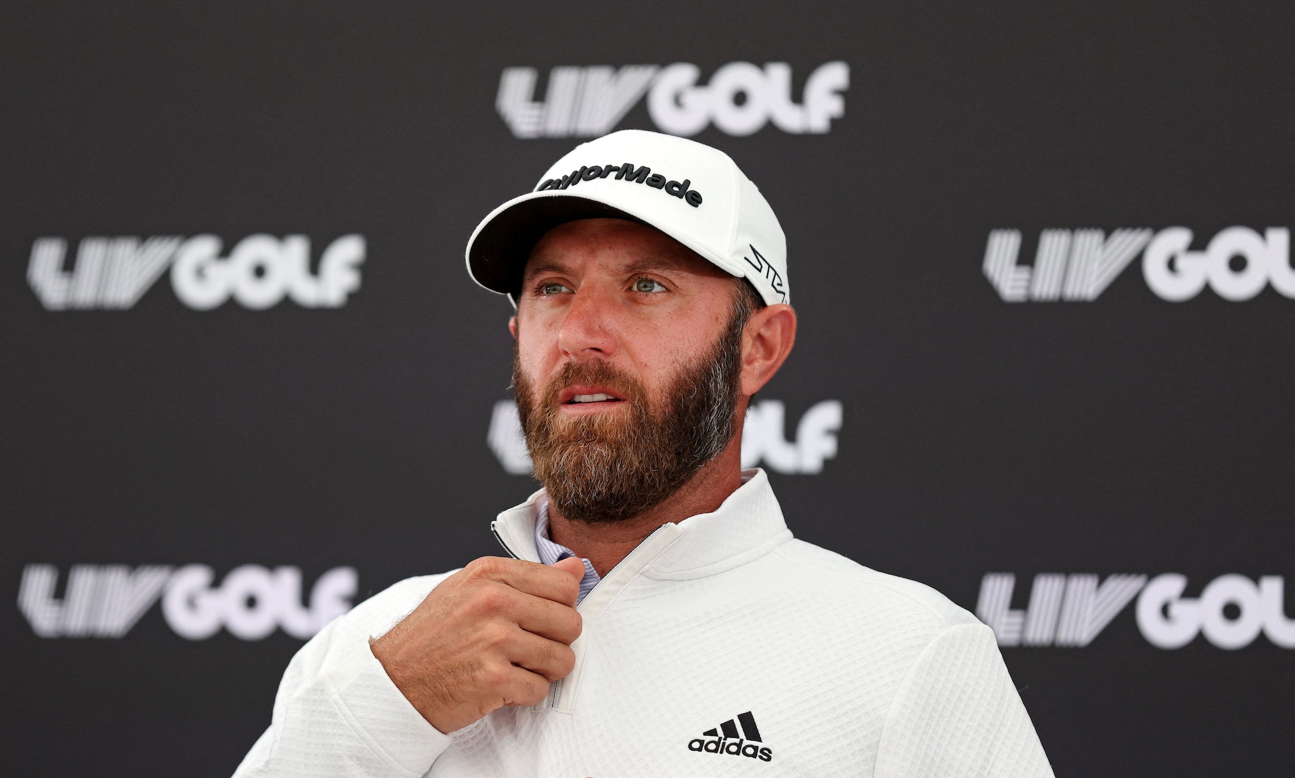 US golfer Dustin Johnson attends a press conference ahead of the forthcoming LIV Golf Invitational Series event at The Centurion Club in St Albans, north of London, on June 7, 2022. - Former world number one golfer Dustin Johnson confirmed on Tuesday he has resigned his membership of the US PGA Tour to play in the breakaway LIV Golf Invitational Series. The decision effectively rules the American two-time major winner out of participating in the Ryder Cup, which pits the United States against Europe every two years. Six-time major winner Phil Mickelson confirmed on Monday he had also signed up to play in the inaugural LIV event in a major coup for the organisers. (Photo by ADRIAN DENNIS / AFP) (Photo by ADRIAN DENNIS/AFP via Getty Images)