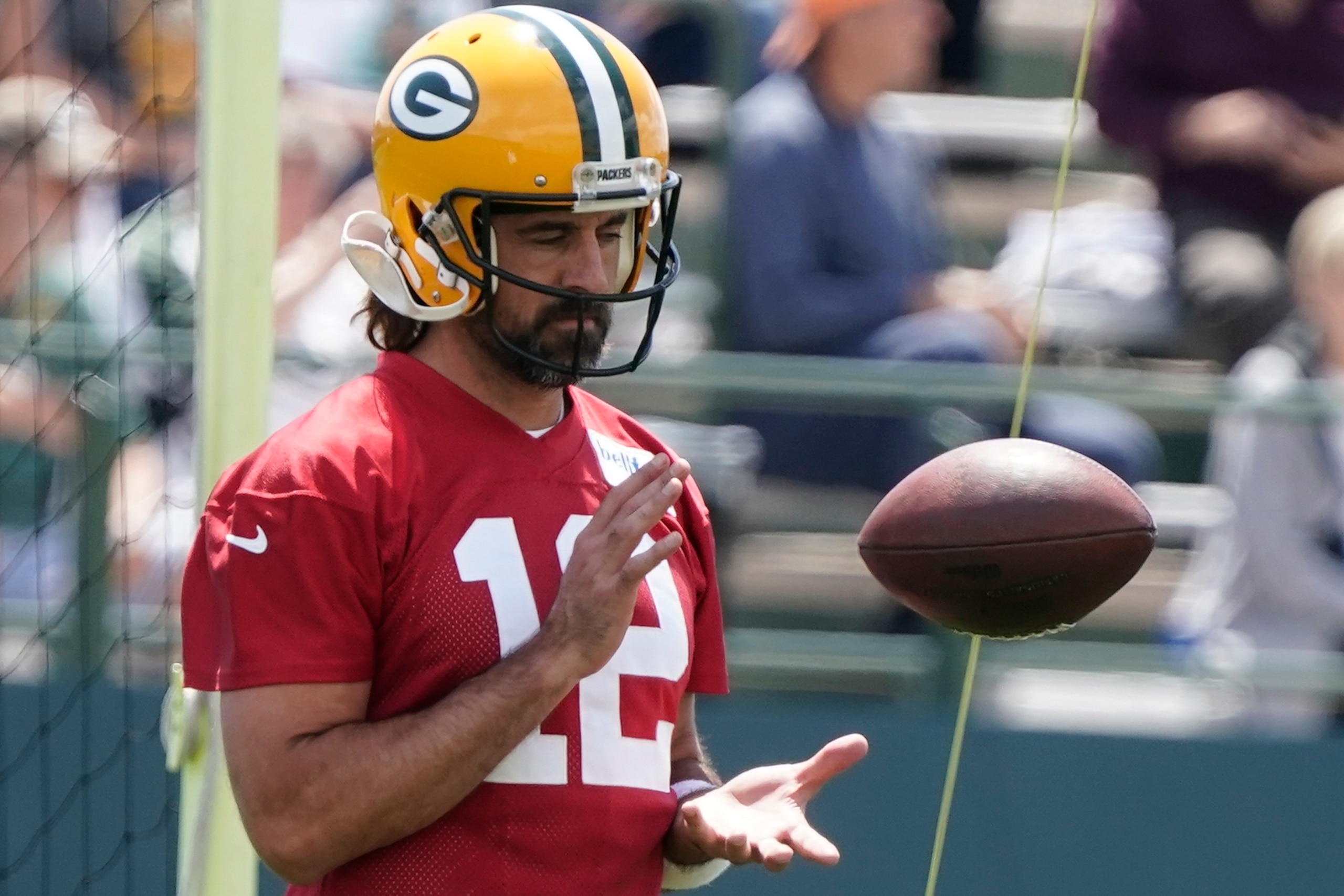 Green Bay Packers' Aaron Rodgers runs a drill at the NFL football team's practice field Tuesday, June 7, 2022, in Green Bay, Wis. (AP Photo/Morry Gash)