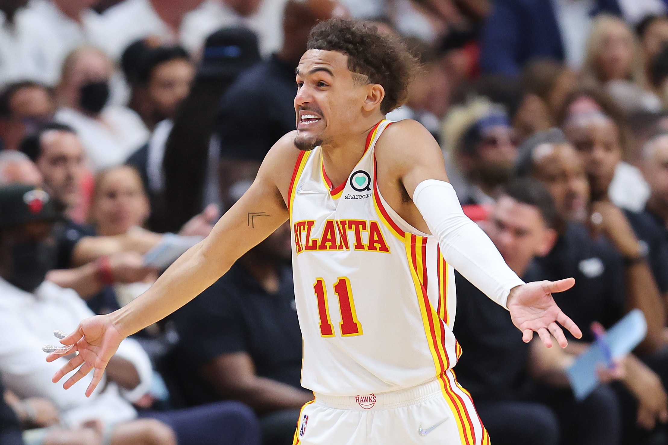 MIAMI, FLORIDA - APRIL 26: Trae Young #11 of the Atlanta Hawks reacts against the Miami Heat during the second half in Game Five of the Eastern Conference First Round at FTX Arena on April 26, 2022 in Miami, Florida. NOTE TO USER: User expressly acknowledges and agrees that, by downloading and or using this photograph, User is consenting to the terms and conditions of the Getty Images License Agreement.  (Photo by Michael Reaves/Getty Images)