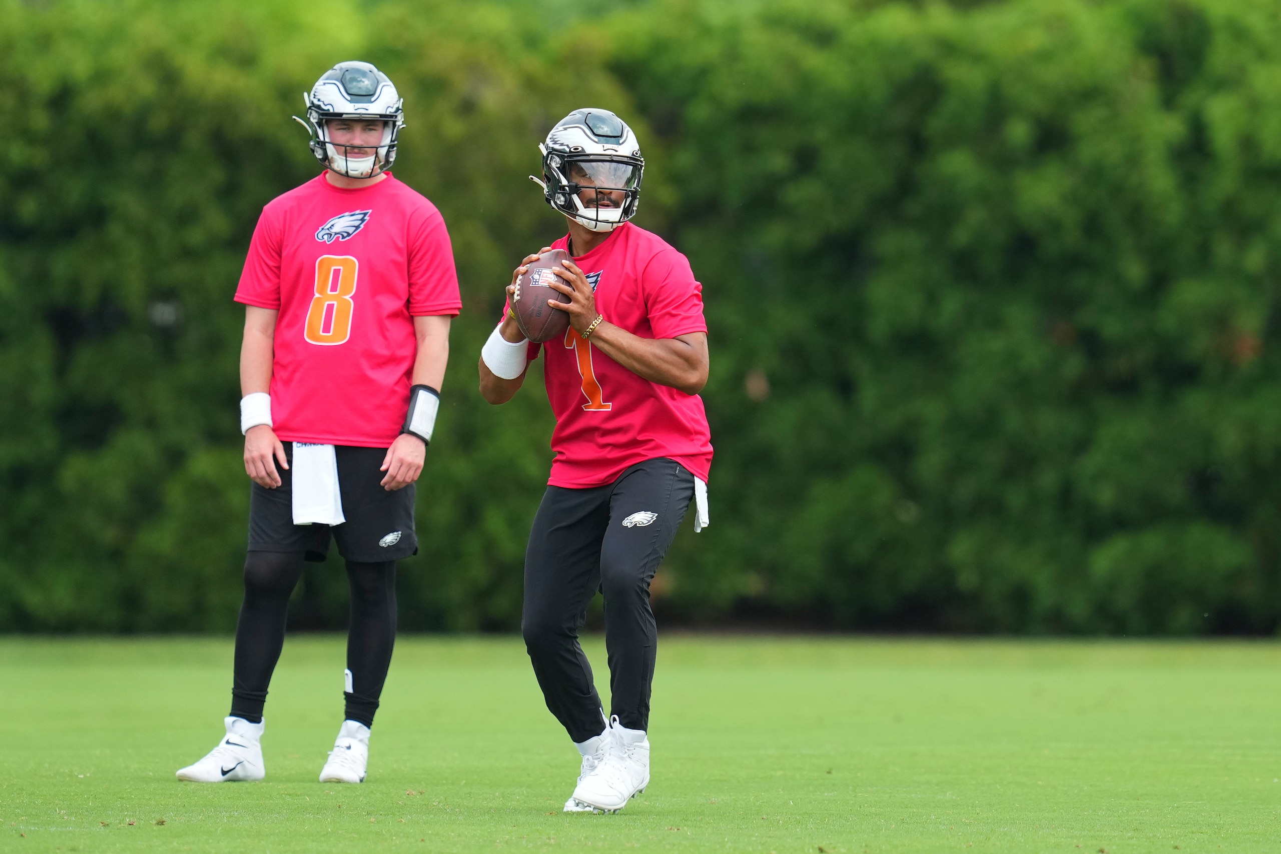 PHILADELPHIA, PA - JUNE 03: Jalen Hurts #1 of the Philadelphia Eagles throws a pass as Carson Strong #8 looks on during OTAs at the NovaCare Complex on June 3, 2022 in Philadelphia, Pennsylvania. (Photo by Mitchell Leff/Getty Images)
