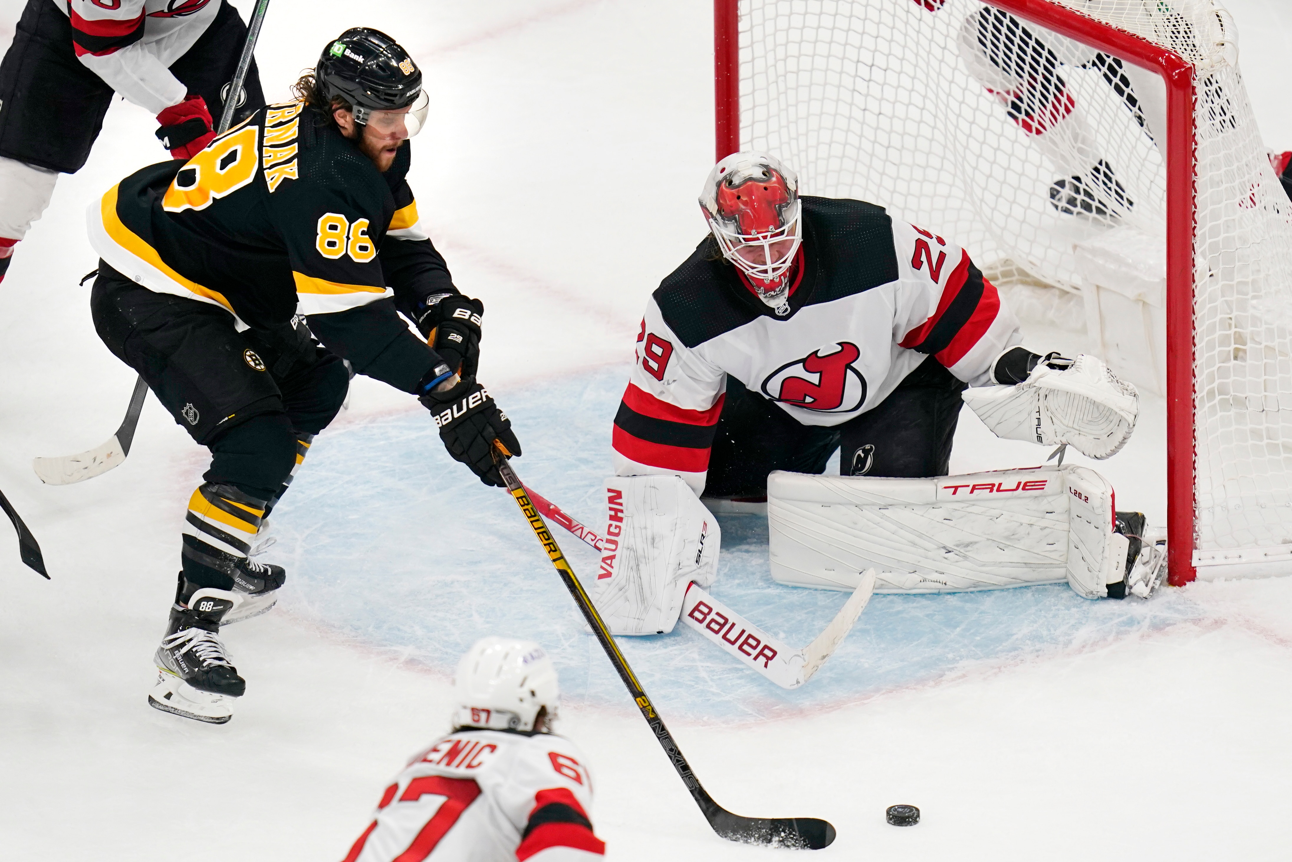 Boston Bruins right wing David Pastrnak (88) sets to shoot during an NHL hockey game, Wednesday, Jan. 5, 2022, in Boston. (AP Photo/Charles Krupa)
