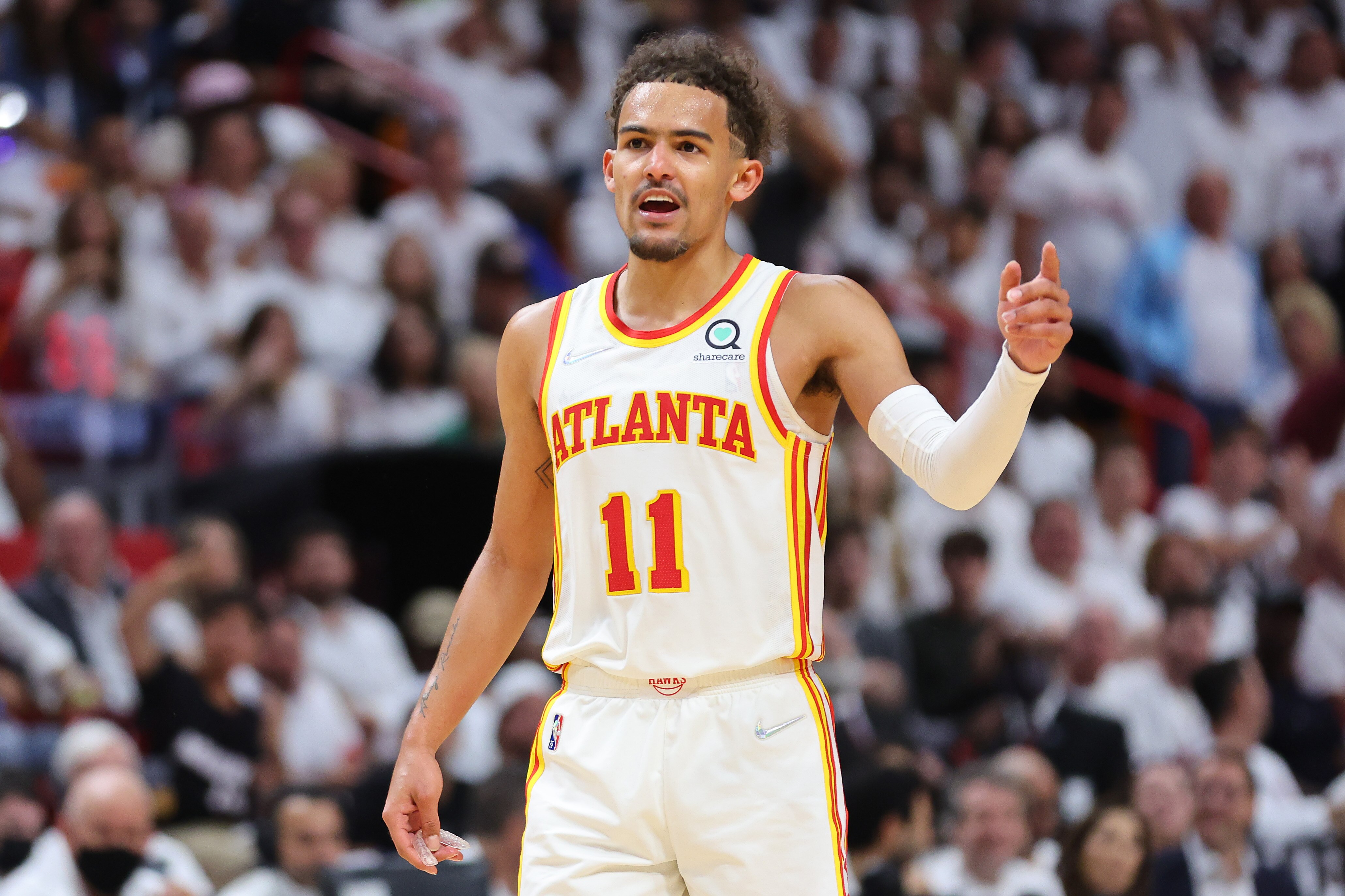 MIAMI, FLORIDA - APRIL 26: Trae Young #11 of the Atlanta Hawks reacts against the Miami Heat in Game Five of the Eastern Conference First Round at FTX Arena on April 26, 2022 in Miami, Florida. NOTE TO USER: User expressly acknowledges and agrees that, by downloading and or using this photograph, User is consenting to the terms and conditions of the Getty Images License Agreement.  (Photo by Michael Reaves/Getty Images)