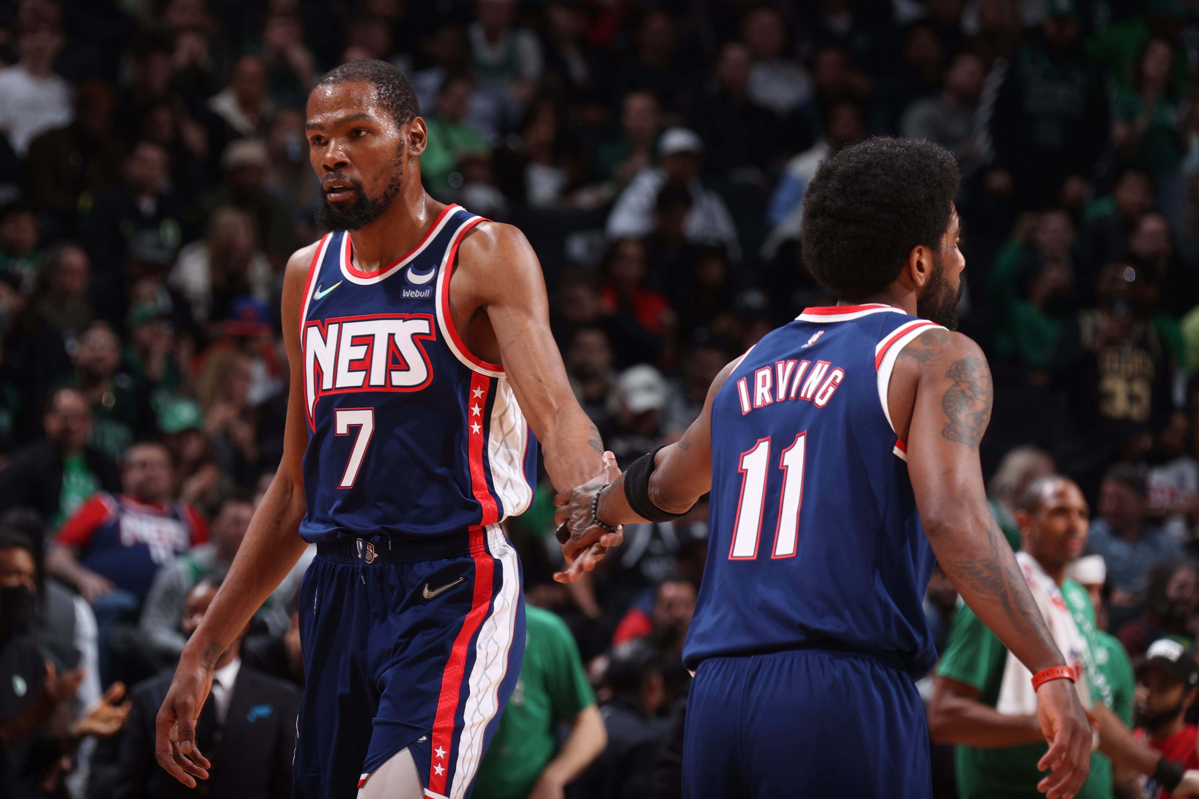 BROOKLYN, NY - APRIL 25: Kevin Durant #7 hi-fives Kyrie Irving #11 of the Brooklyn Nets during Round 1 Game 4 of the 2022 NBA Playoffs on April 25, 2022 at Barclays Center in Brooklyn, New York. NOTE TO USER: User expressly acknowledges and agrees that, by downloading and or using this Photograph, user is consenting to the terms and conditions of the Getty Images License Agreement. Mandatory Copyright Notice: Copyright 2022 NBAE (Photo by Nathaniel S. Butler/NBAE via Getty Images)